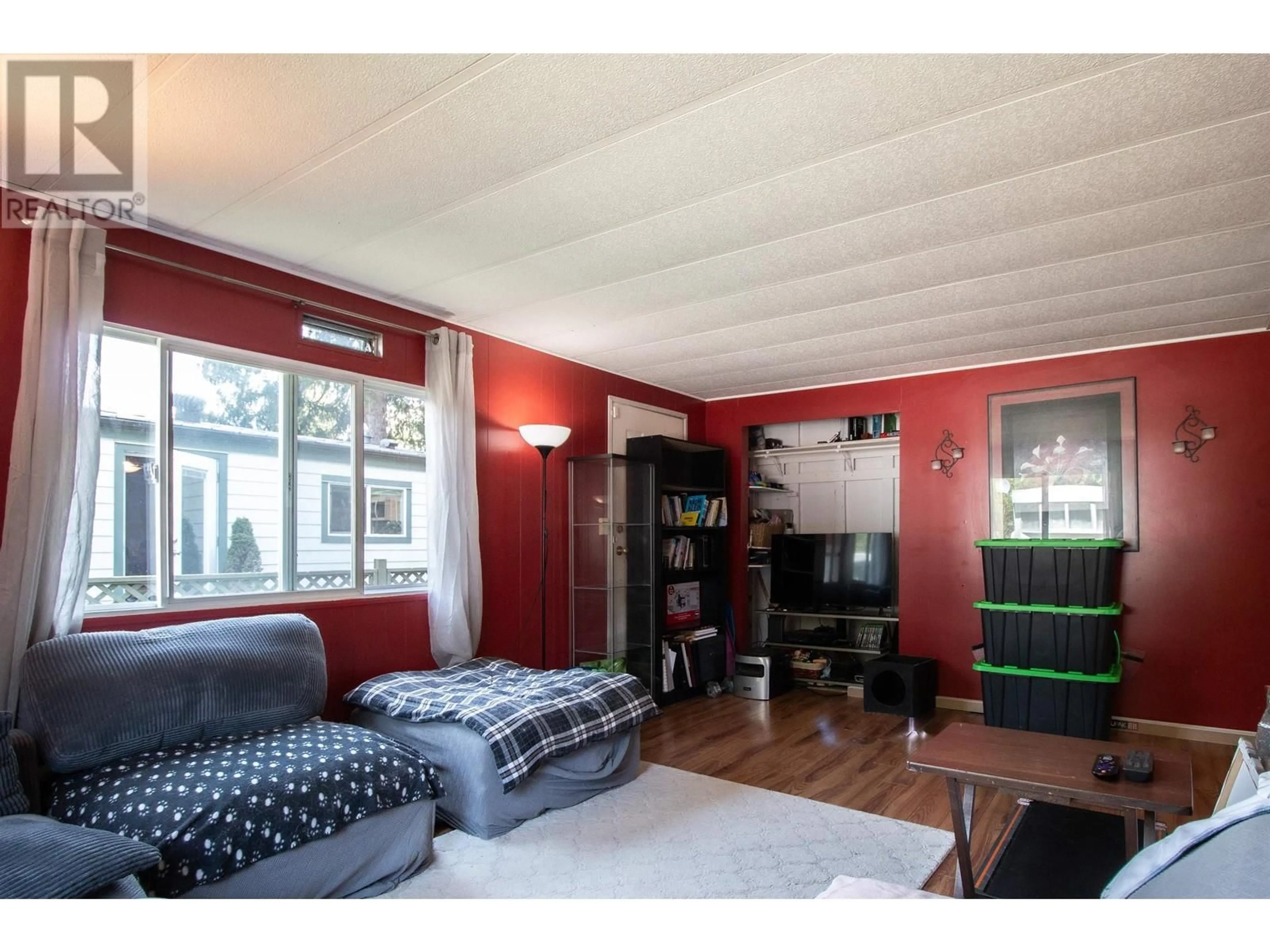 Living room with furniture, wood/laminate floor for 215 - 1830 MAMQUAM ROAD, Squamish British Columbia V8B0J1