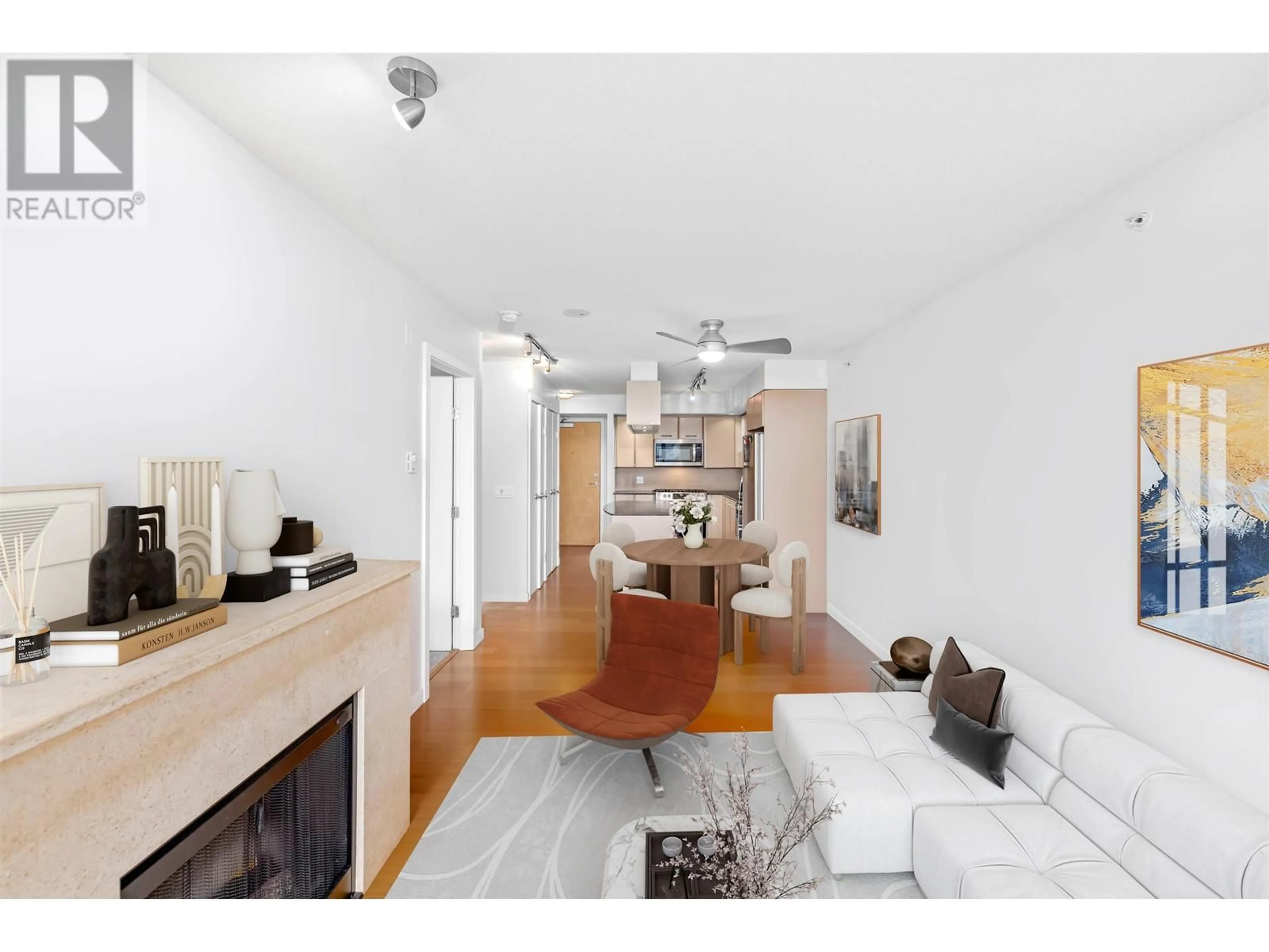 Living room with furniture, wood/laminate floor for 602 - 683 VICTORIA PARK, North Vancouver British Columbia V7M0A2