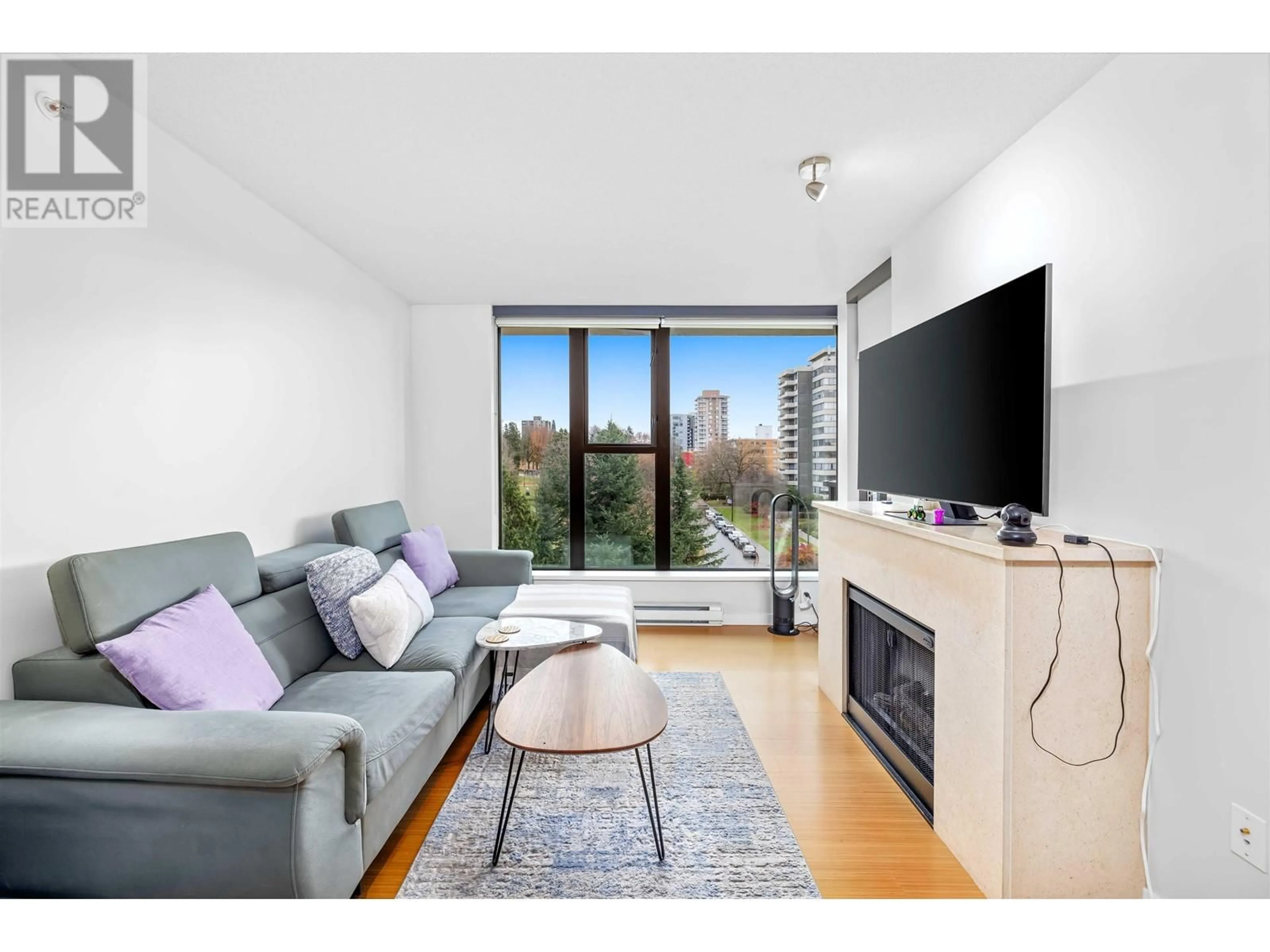 Living room with furniture, wood/laminate floor for 602 - 683 VICTORIA PARK, North Vancouver British Columbia V7M0A2