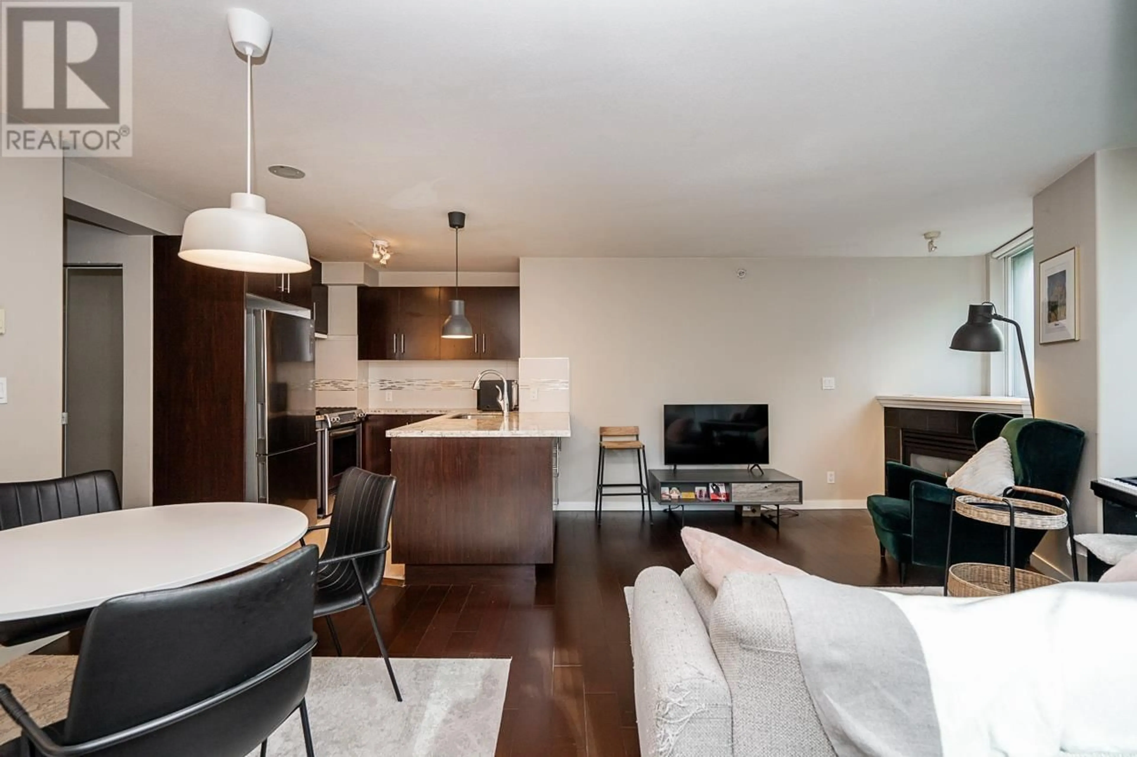 Living room with furniture, wood/laminate floor for 601 - 1328 PENDER STREET, Vancouver British Columbia V6E4T1
