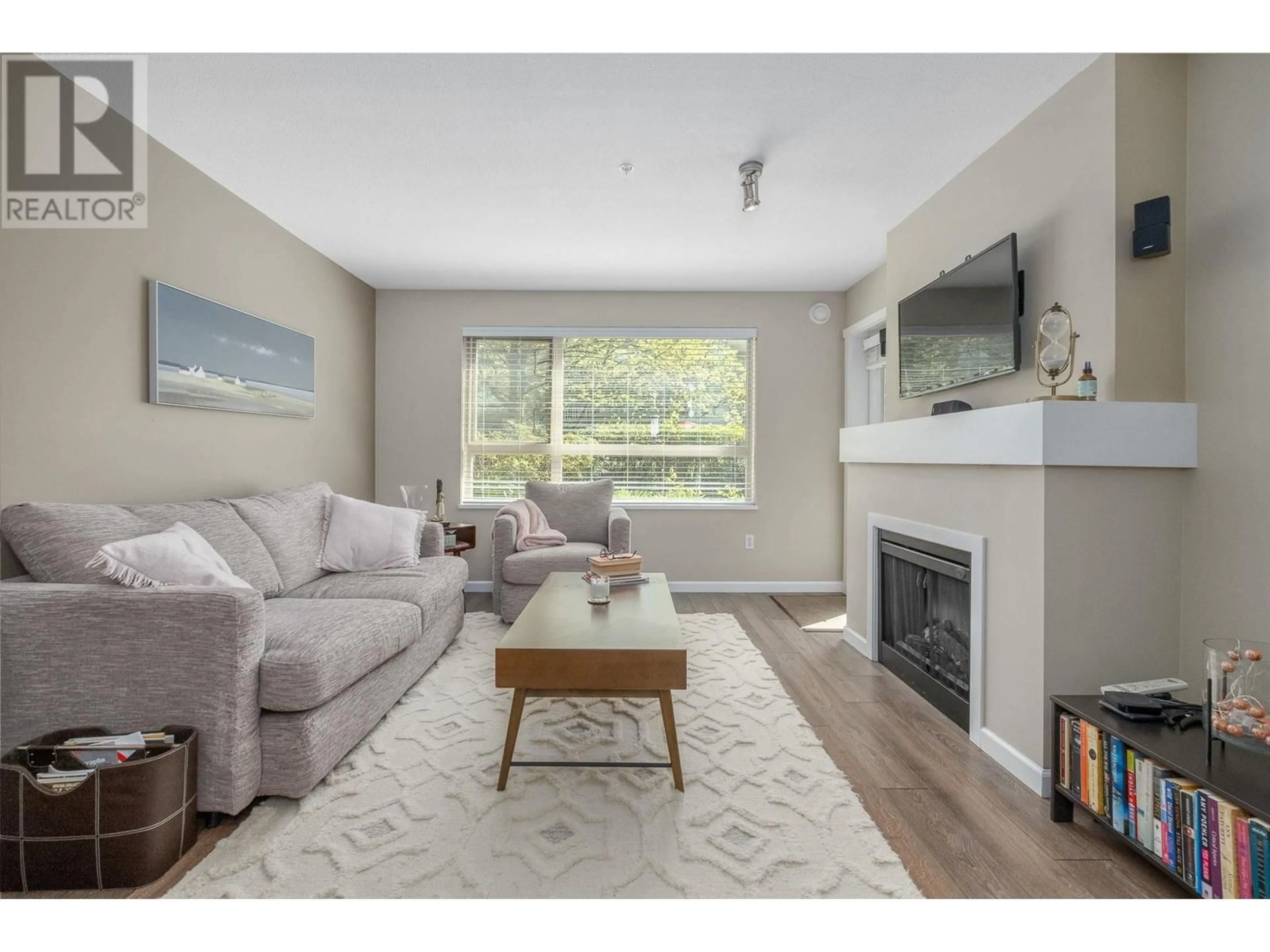 Living room with furniture, wood/laminate floor for 108 - 700 KLAHANIE DRIVE, Port Moody British Columbia V3H5L3