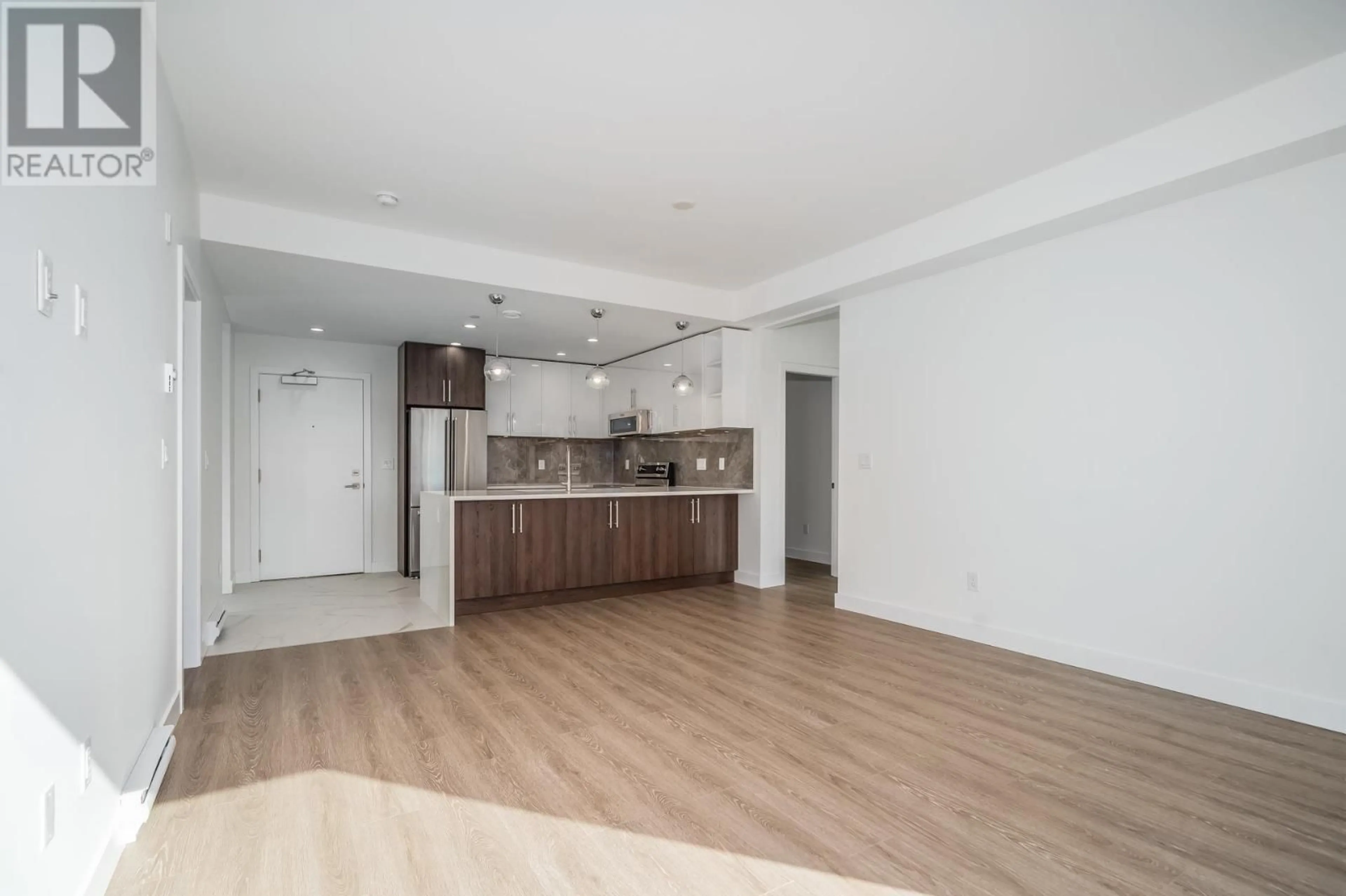 Open concept kitchen, wood/laminate floor for 304 - 11703 FRASER STREET, Maple Ridge British Columbia V2X2L8