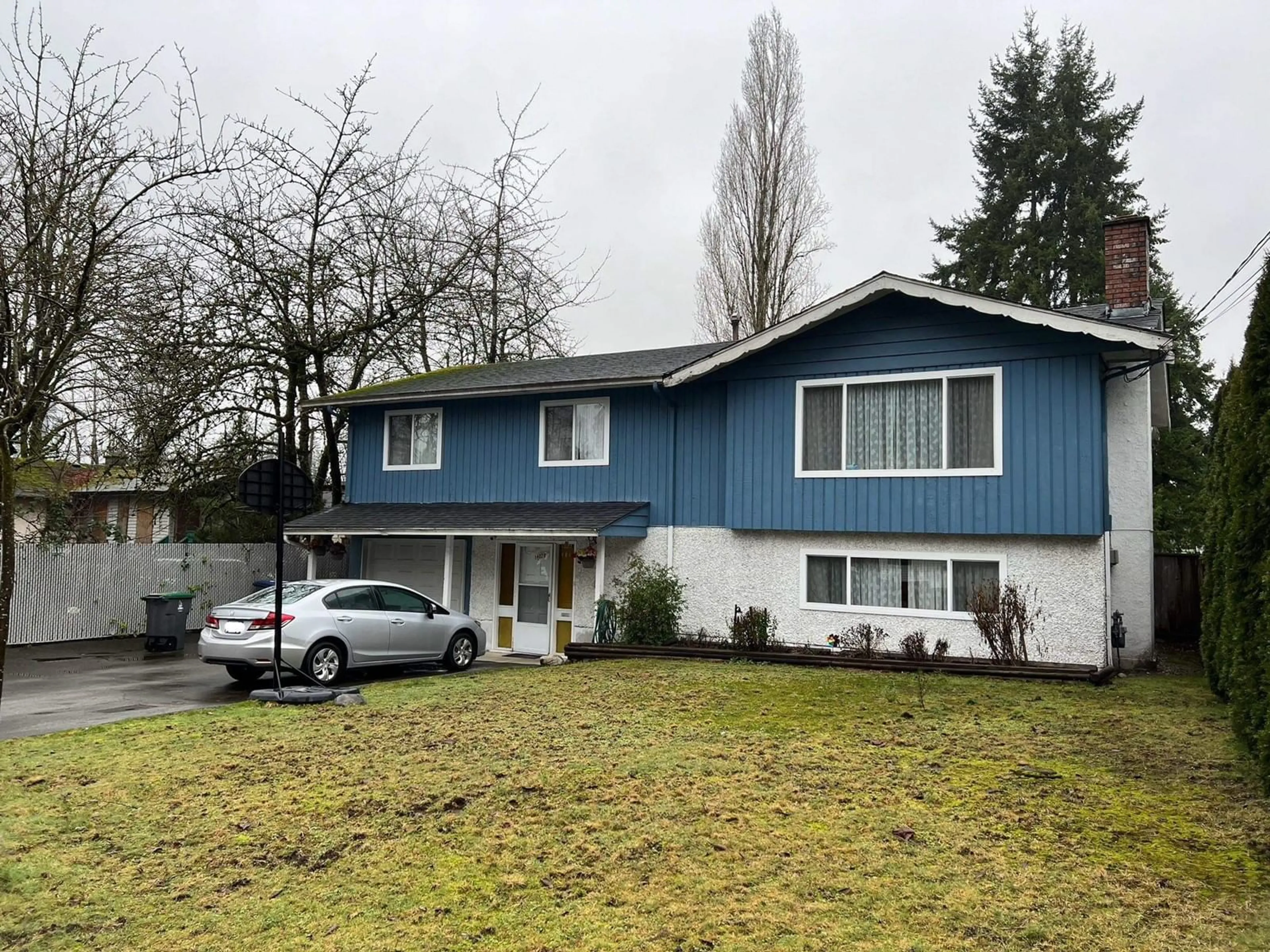 Home with vinyl exterior material, street for 14029 103, Surrey British Columbia V3T1S1
