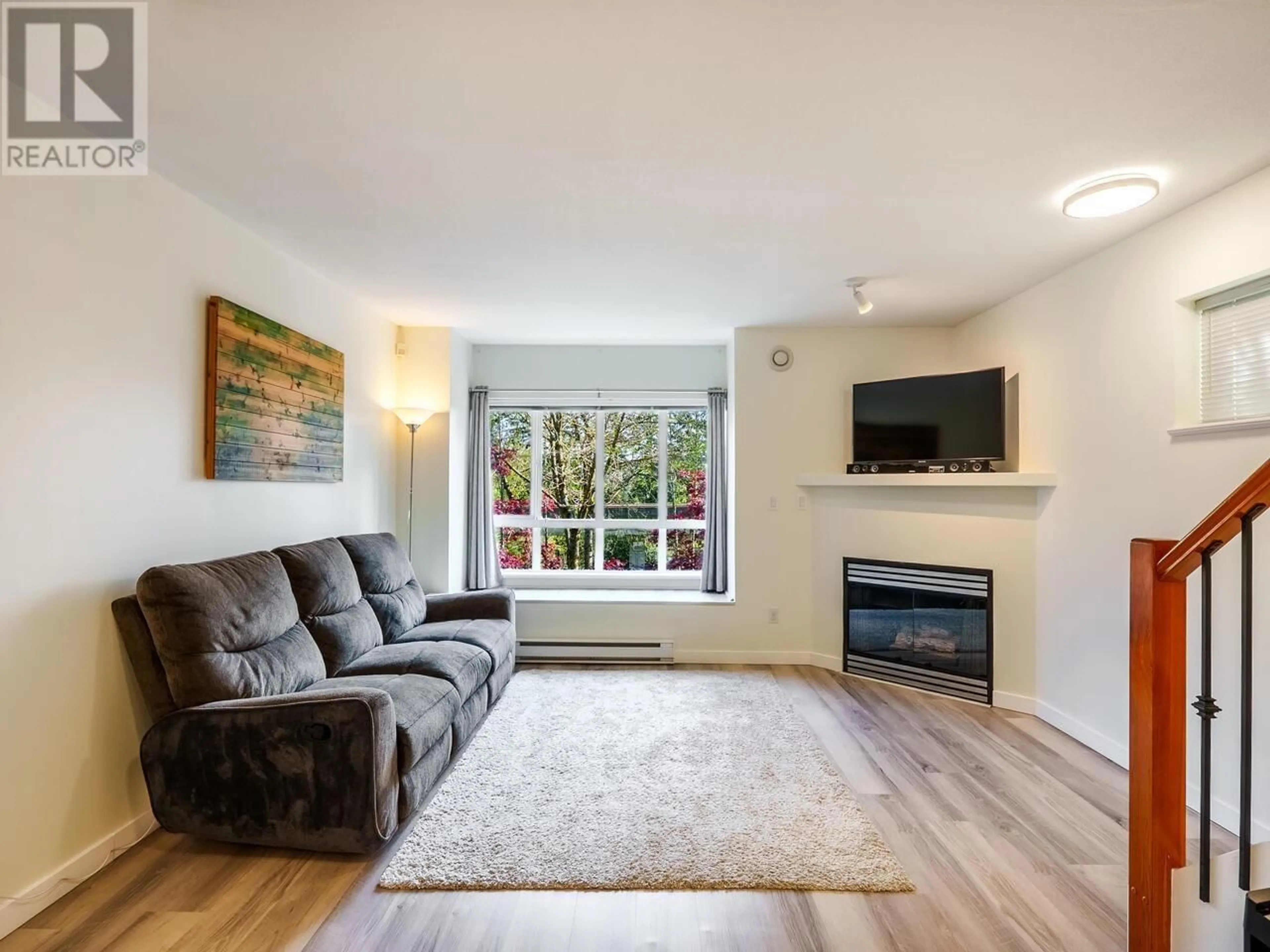 Living room with furniture, wood/laminate floor for 6711 PRENTER STREET, Burnaby British Columbia V5E4K5