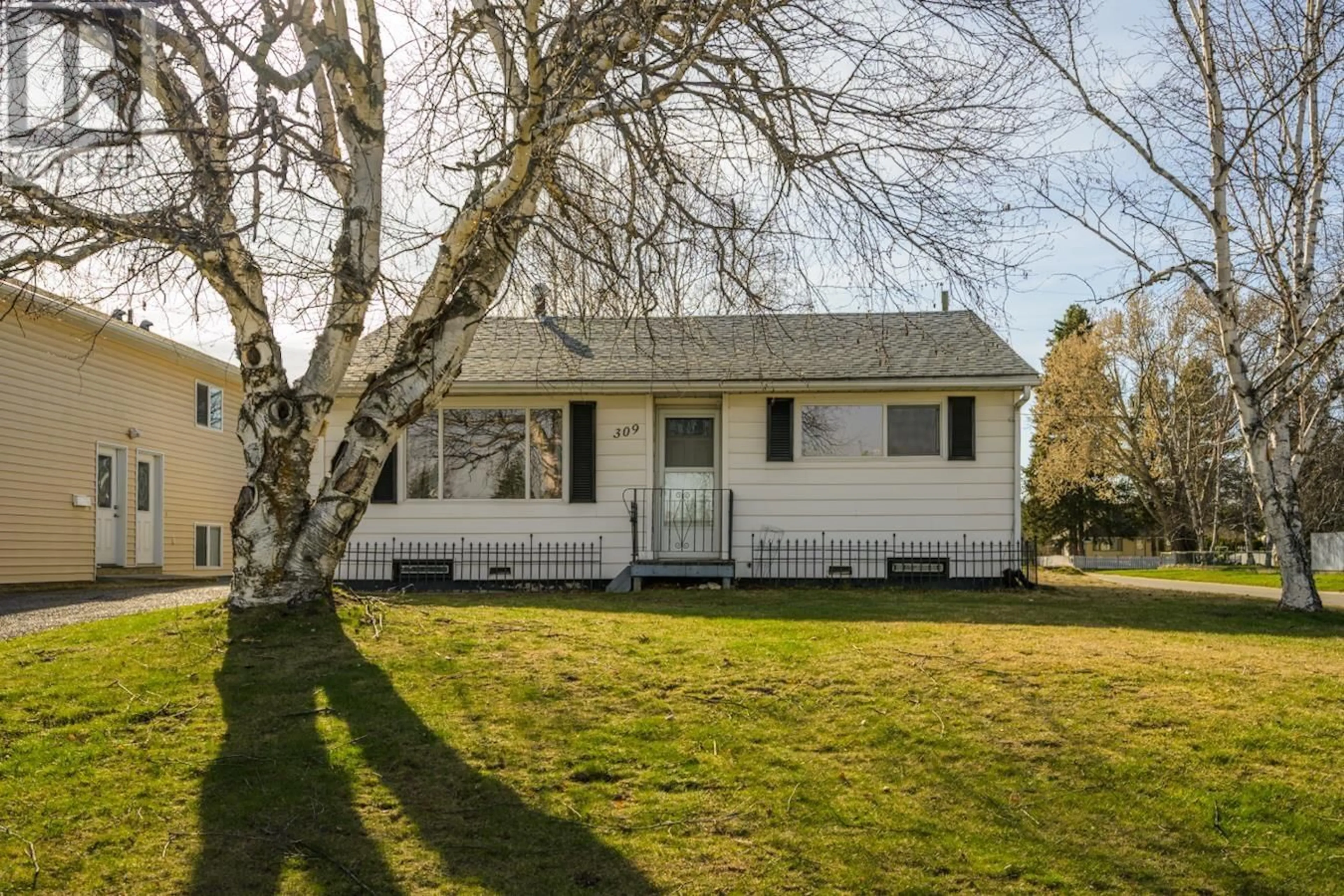 Home with vinyl exterior material, street for 309 WAINWRIGHT STREET, Prince George British Columbia V2M2C3