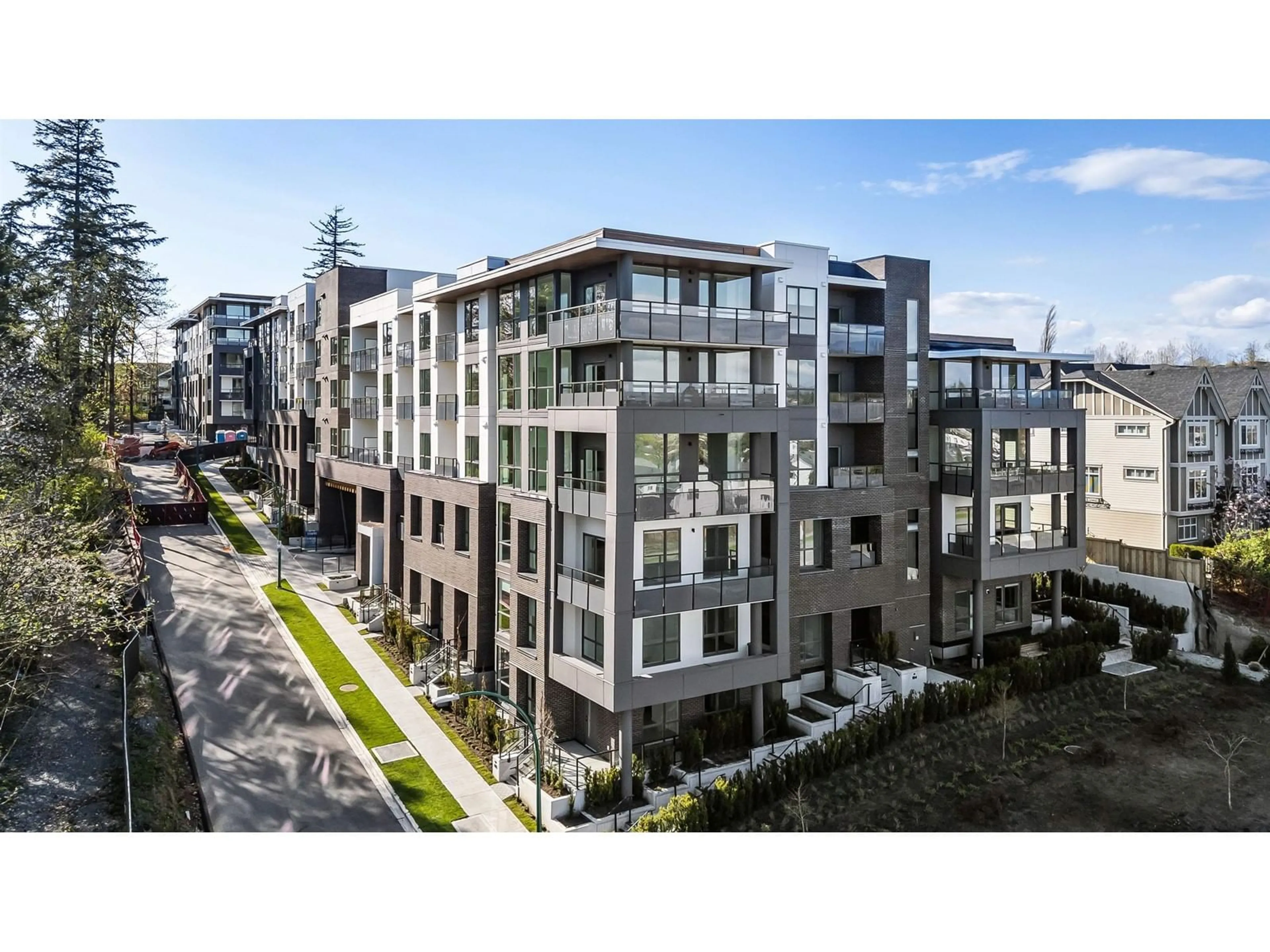 A pic from outside/outdoor area/front of a property/back of a property/a pic from drone, street for 503 - 19577 65B, Surrey British Columbia V4N6Y3