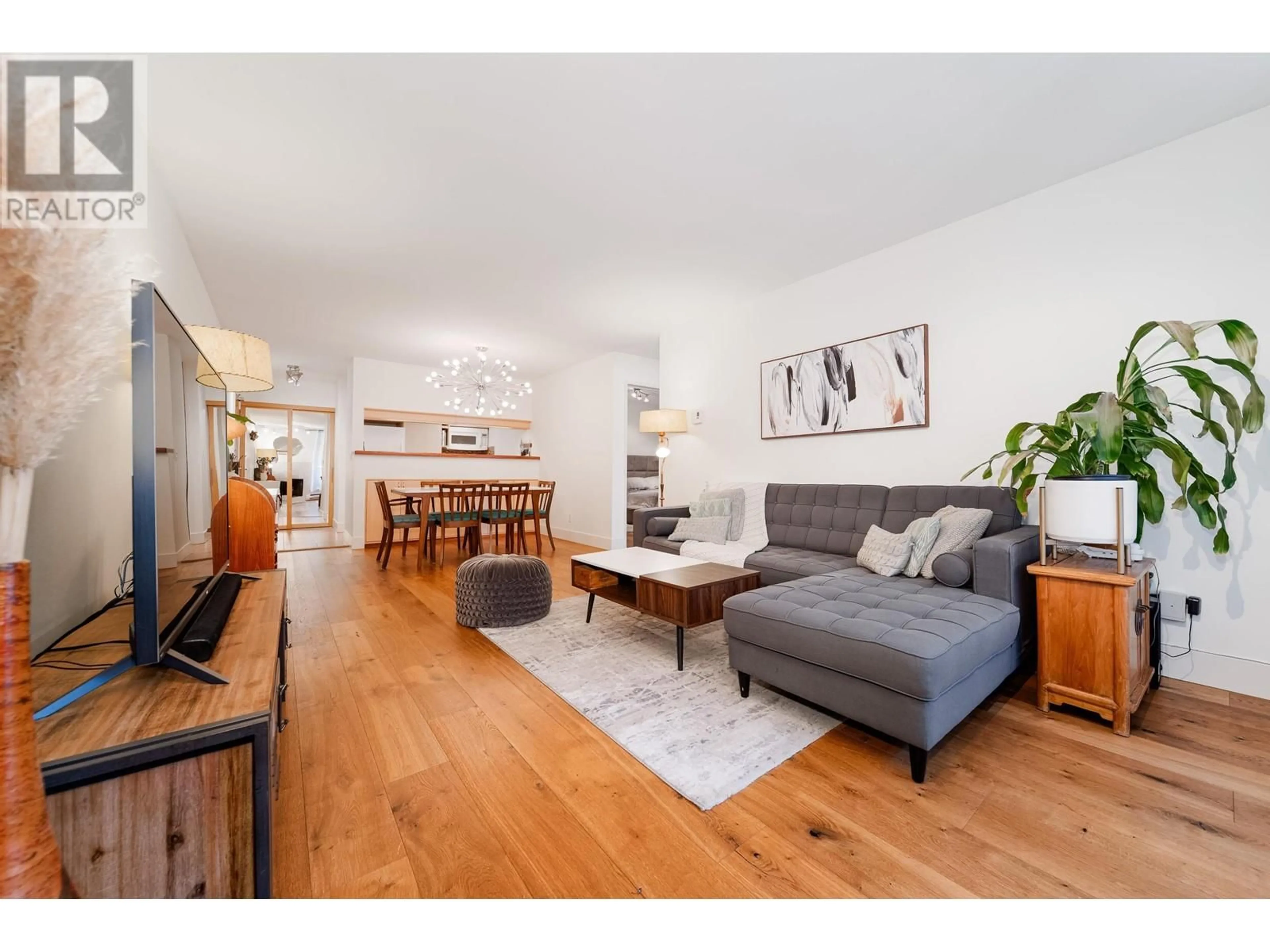 Living room with furniture, wood/laminate floor for 206 - 1232 HARWOOD STREET, Vancouver British Columbia V6E1S2