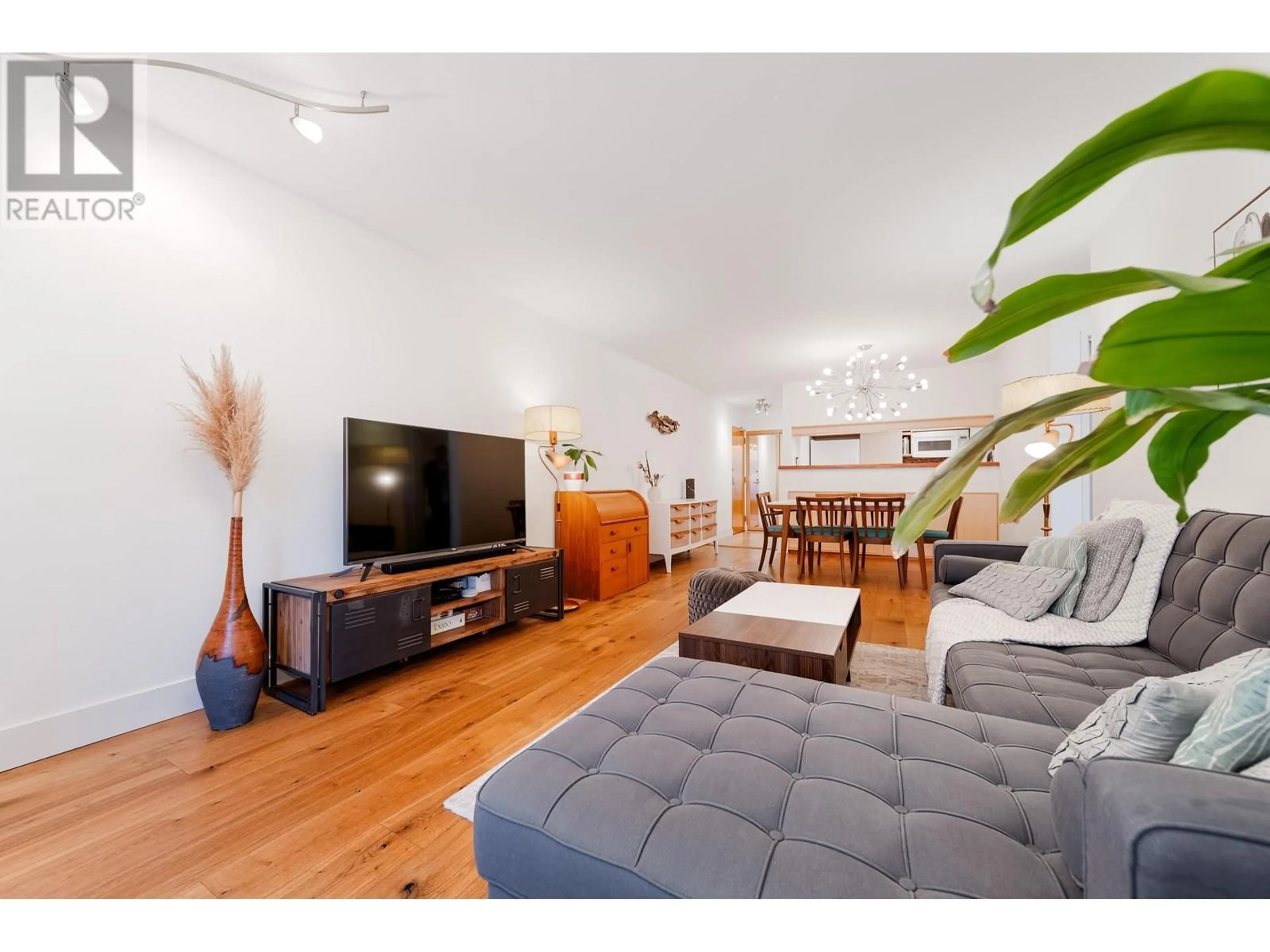 Living room with furniture, wood/laminate floor for 206 - 1232 HARWOOD STREET, Vancouver British Columbia V6E1S2
