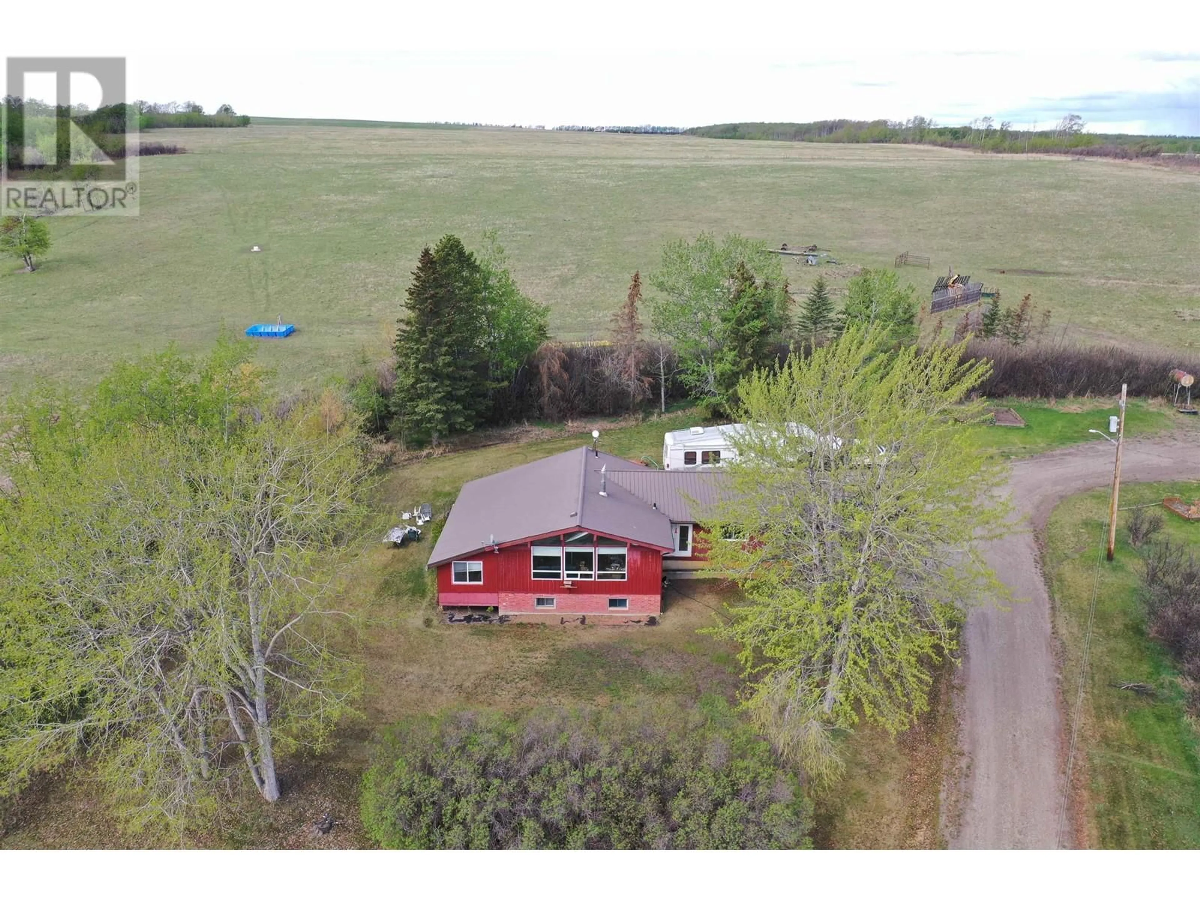 A pic from outside/outdoor area/front of a property/back of a property/a pic from drone, building for 14477 MONTNEY ROAD, Fort St. John British Columbia V1J8E2