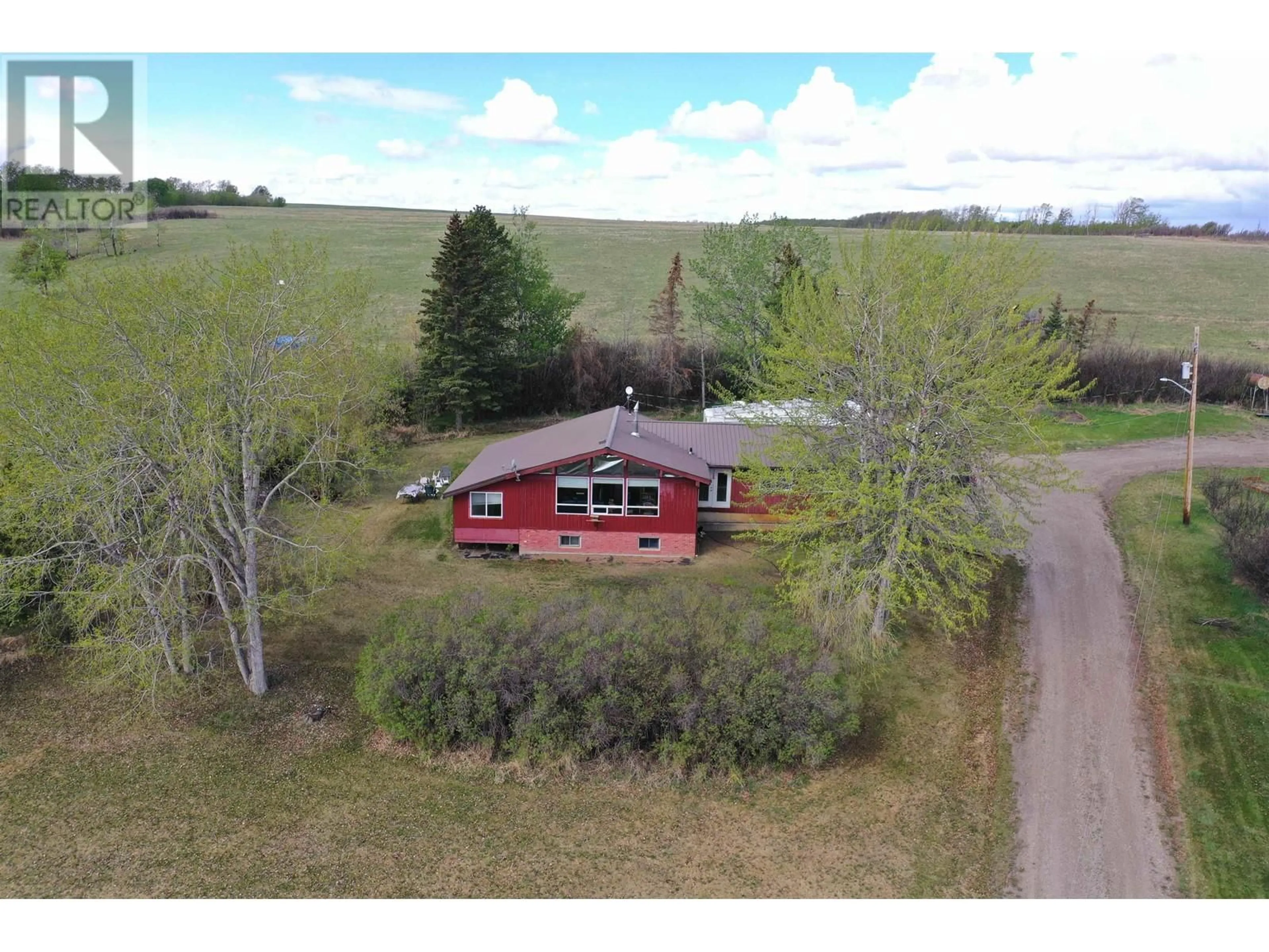 A pic from outside/outdoor area/front of a property/back of a property/a pic from drone, building for 14477 MONTNEY ROAD, Fort St. John British Columbia V1J8E2