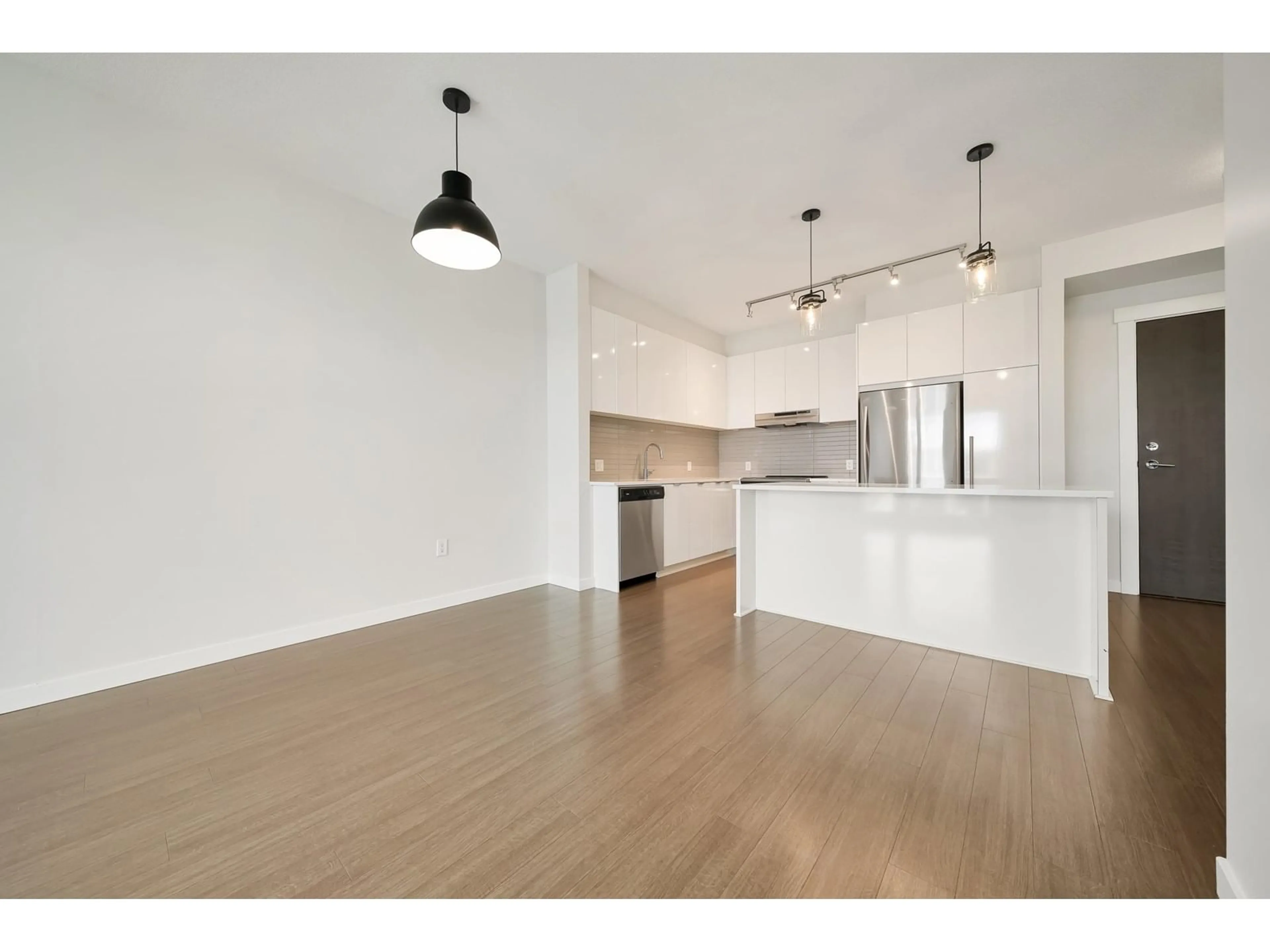 Open concept kitchen, wood/laminate floor for 434 - 31158 WESTRIDGE, Abbotsford British Columbia V2T0K5