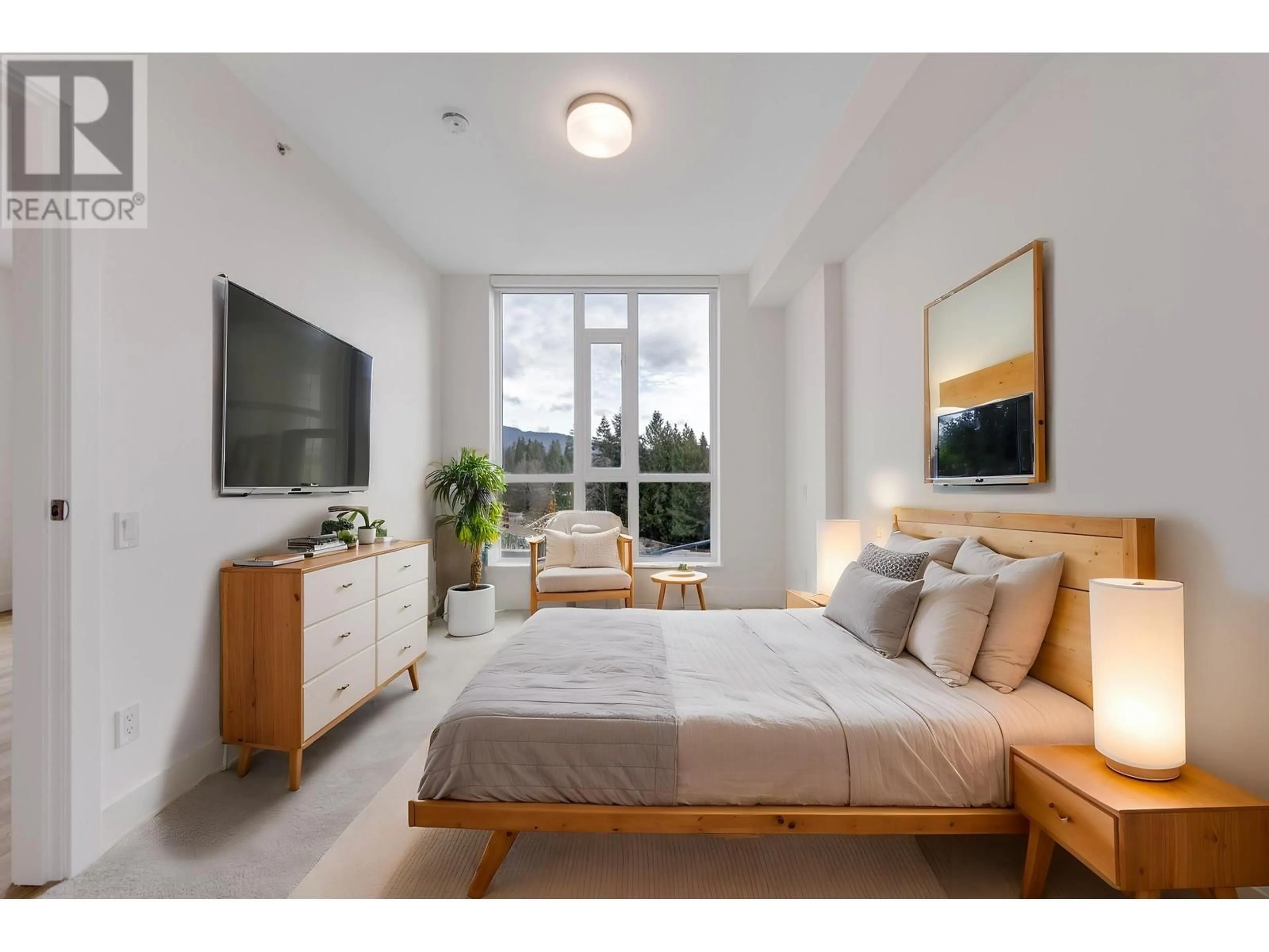 Bedroom with bed, wood/laminate floor for 407 - 2325 EMERY COURT, North Vancouver British Columbia V7J0E8