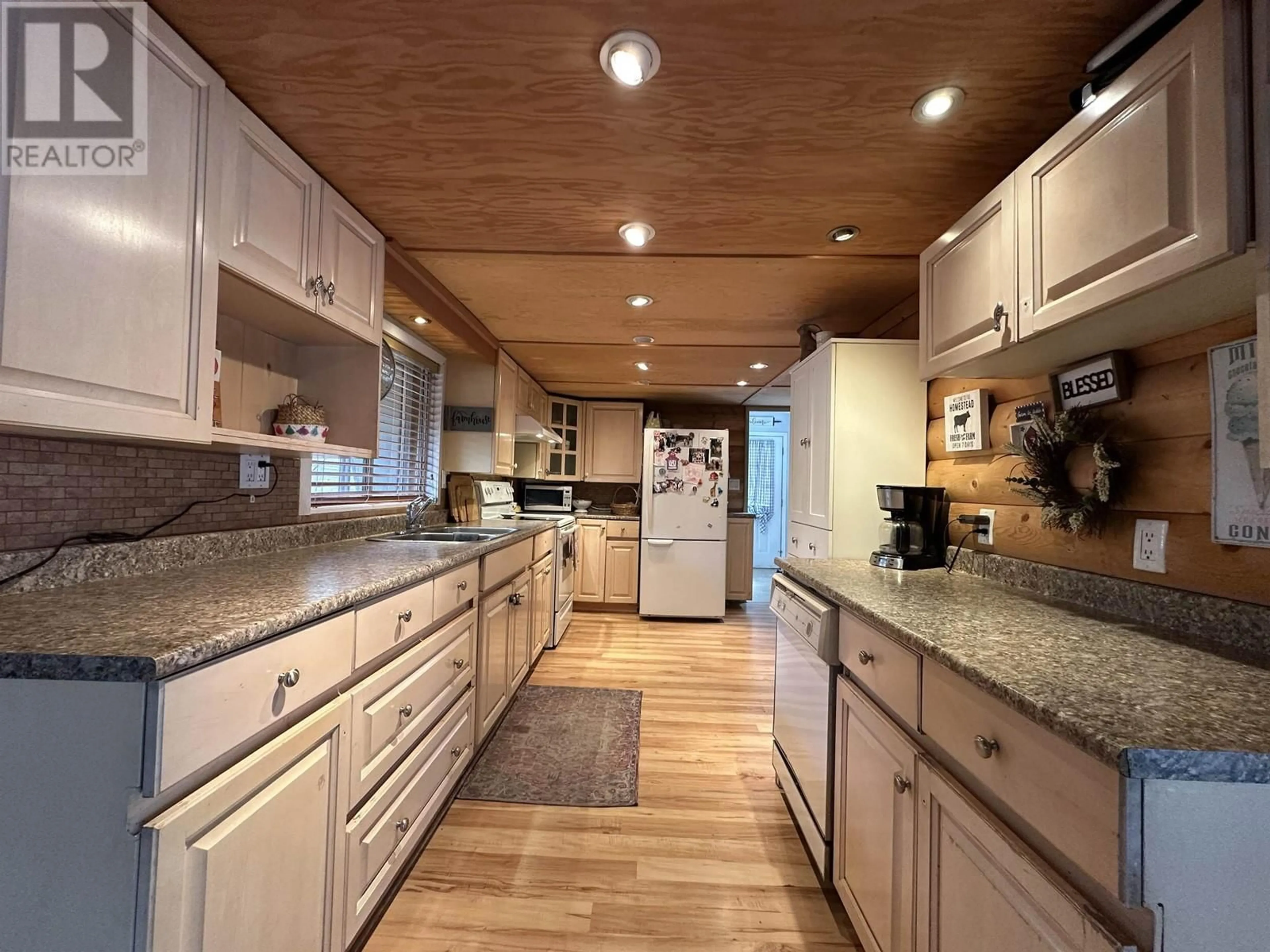 Open concept kitchen, wood/laminate floor for 7536 GAUTHIER ROAD, Deka Lake / Sulphurous / Hathaway Lakes British Columbia V0K1X3
