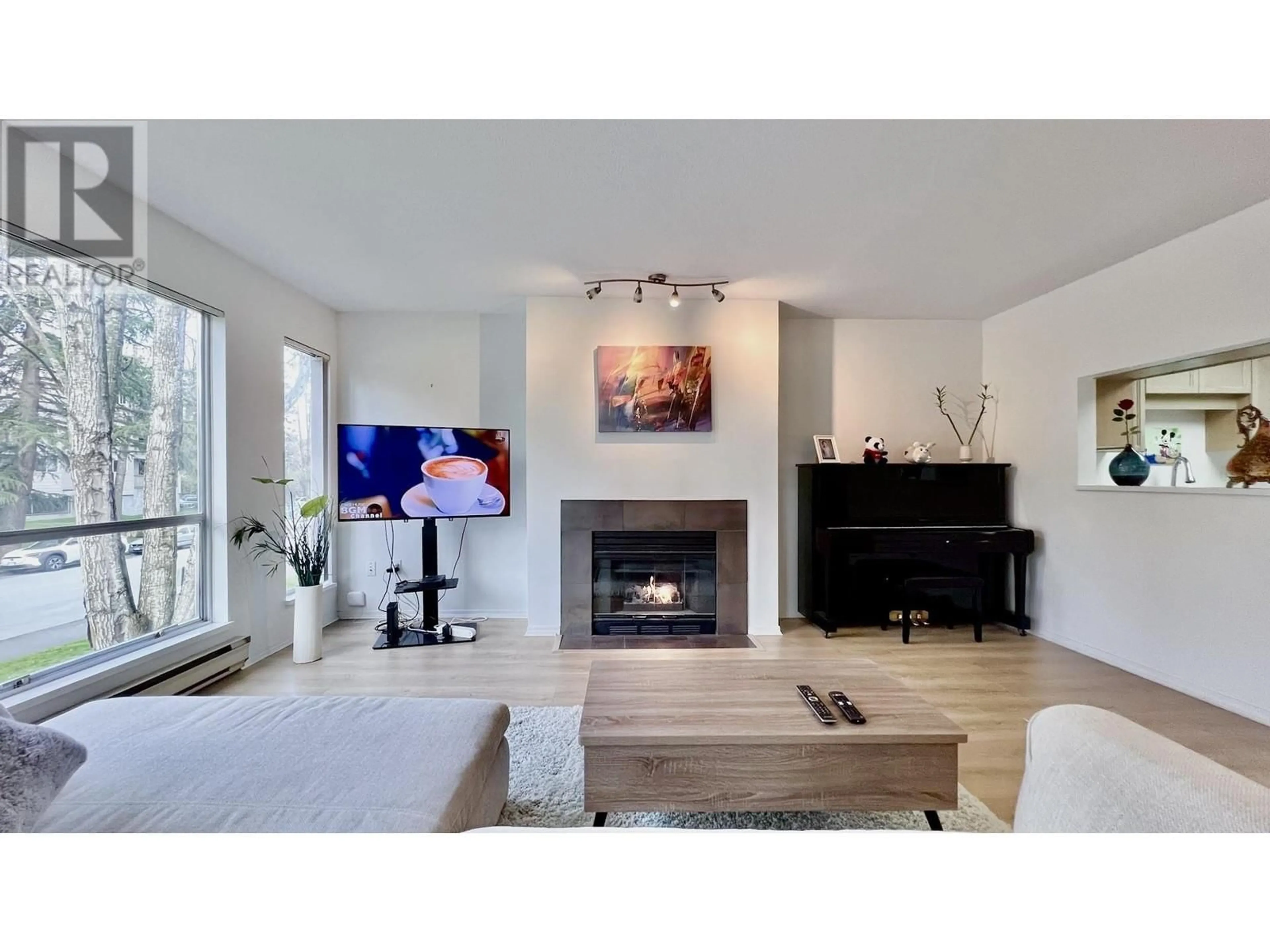 Living room with furniture, wood/laminate floor for 113 - 8300 BENNETT ROAD, Richmond British Columbia V6Y1N5