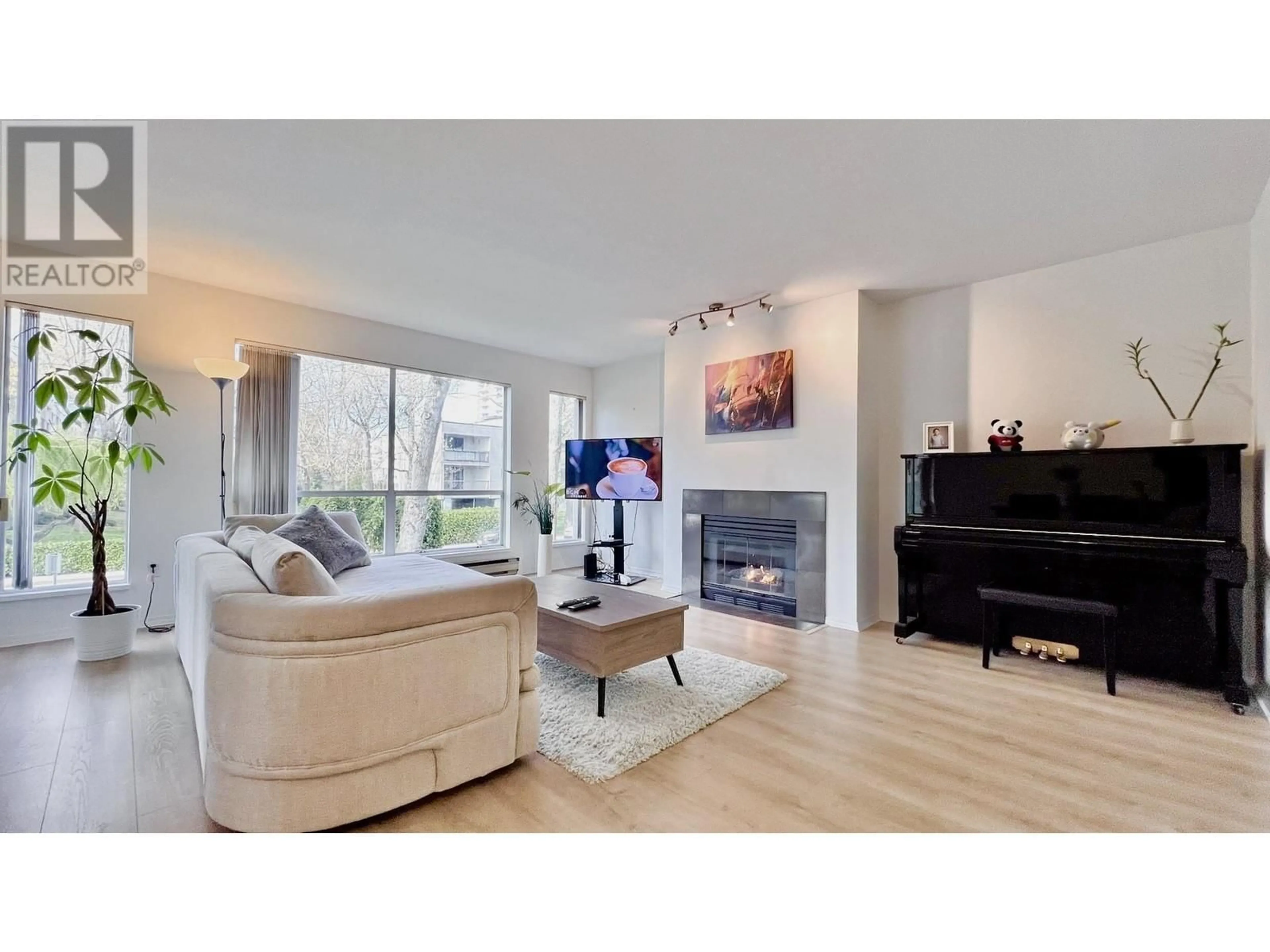 Living room with furniture, wood/laminate floor for 113 - 8300 BENNETT ROAD, Richmond British Columbia V6Y1N5