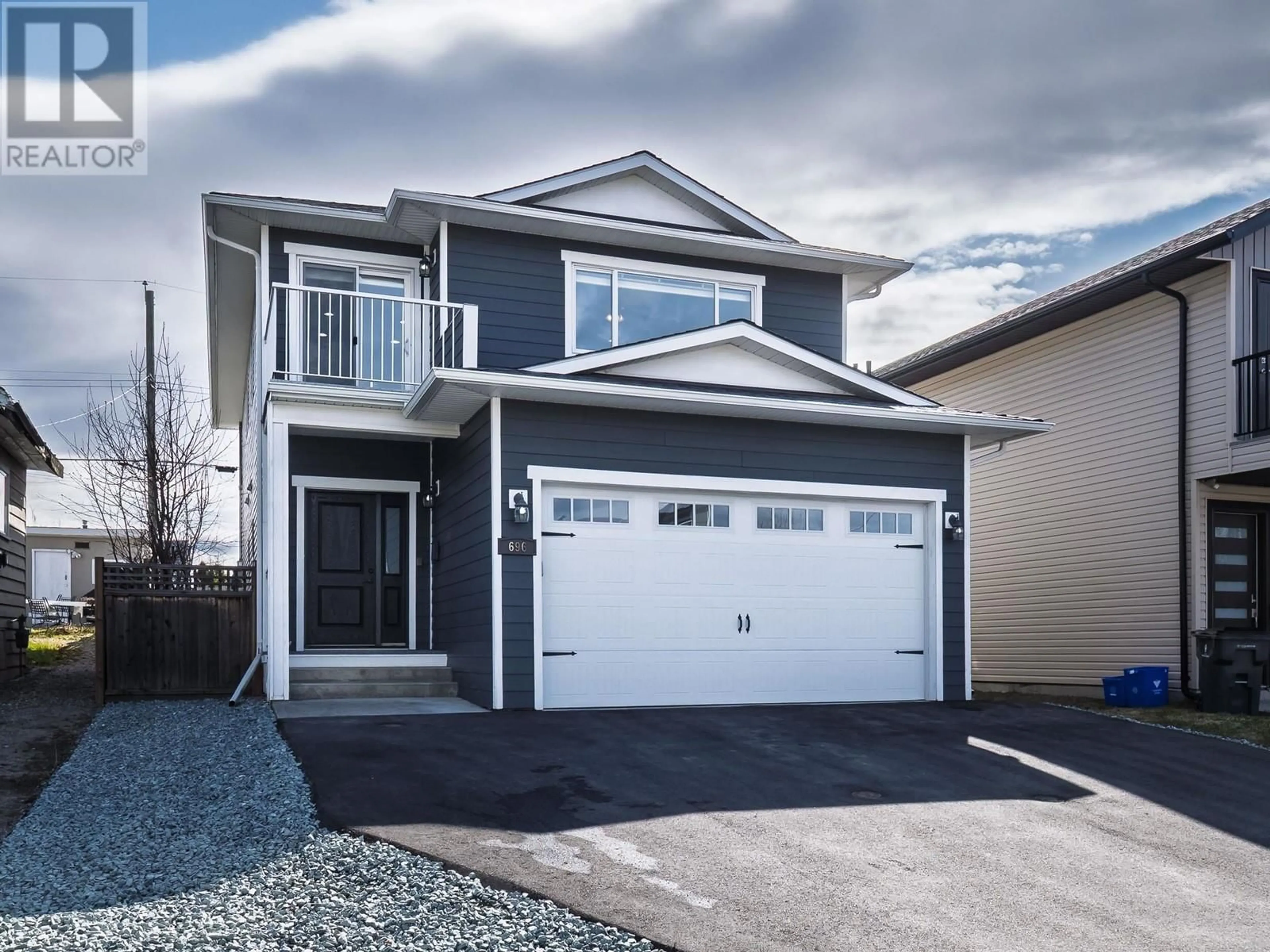 Home with vinyl exterior material, street for 696 JOHNSON STREET, Prince George British Columbia V2M2Z9