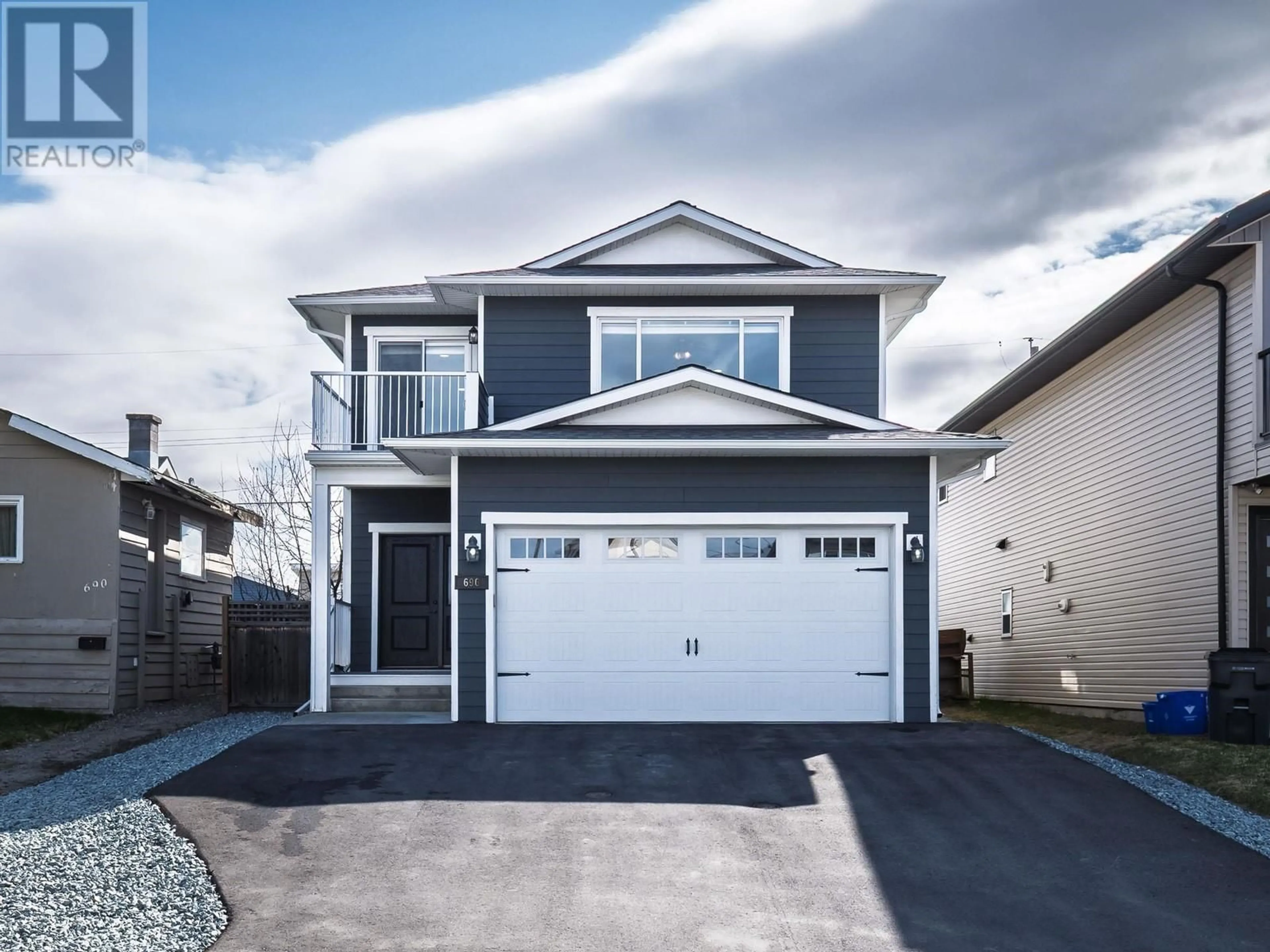 Home with vinyl exterior material, street for 696 JOHNSON STREET, Prince George British Columbia V2M2Z9