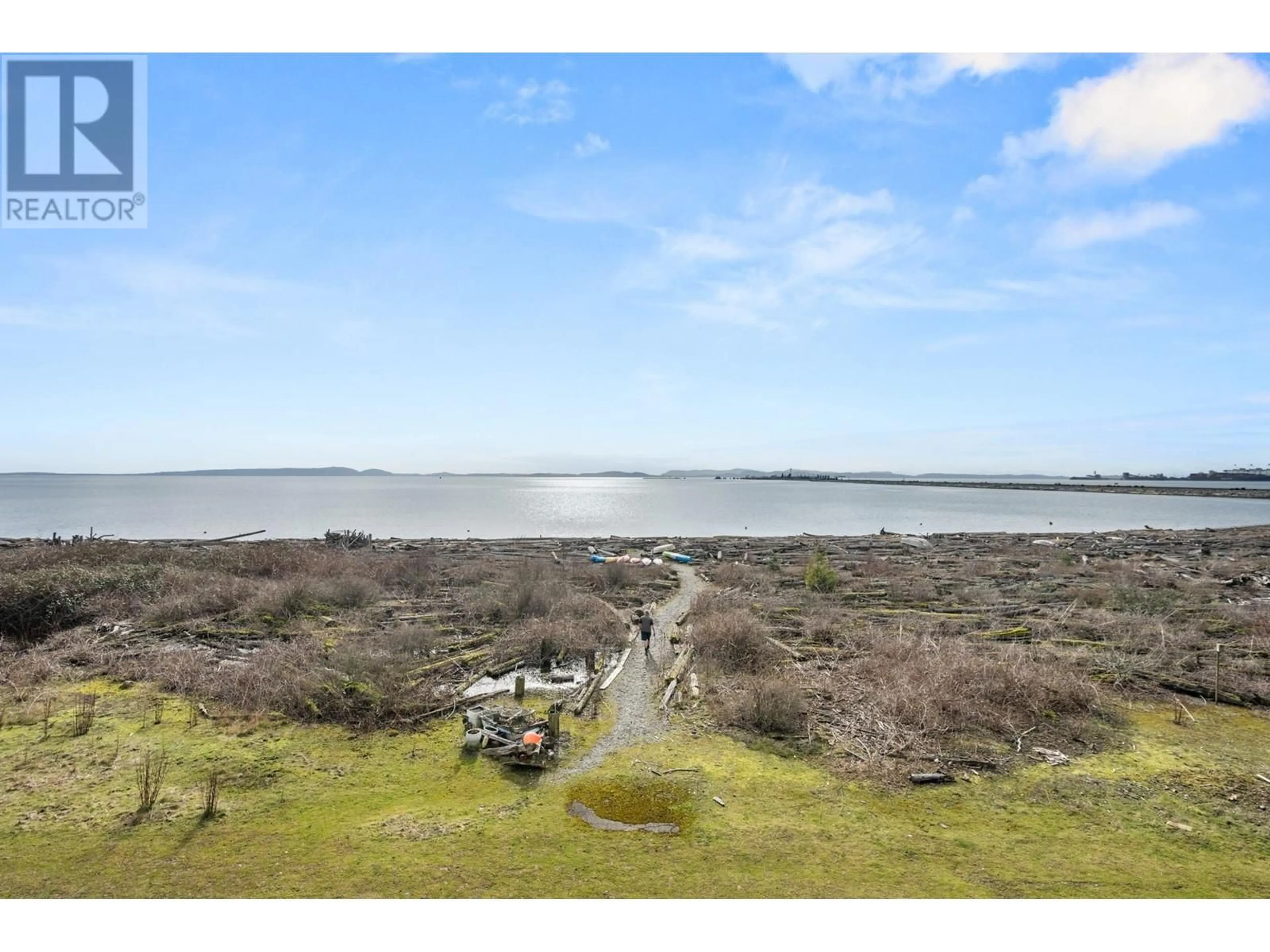A pic from outside/outdoor area/front of a property/back of a property/a pic from drone, water/lake/river/ocean view for 203 - 1120 TSATSU SHORES DRIVE, Tsawwassen British Columbia V4M4G3