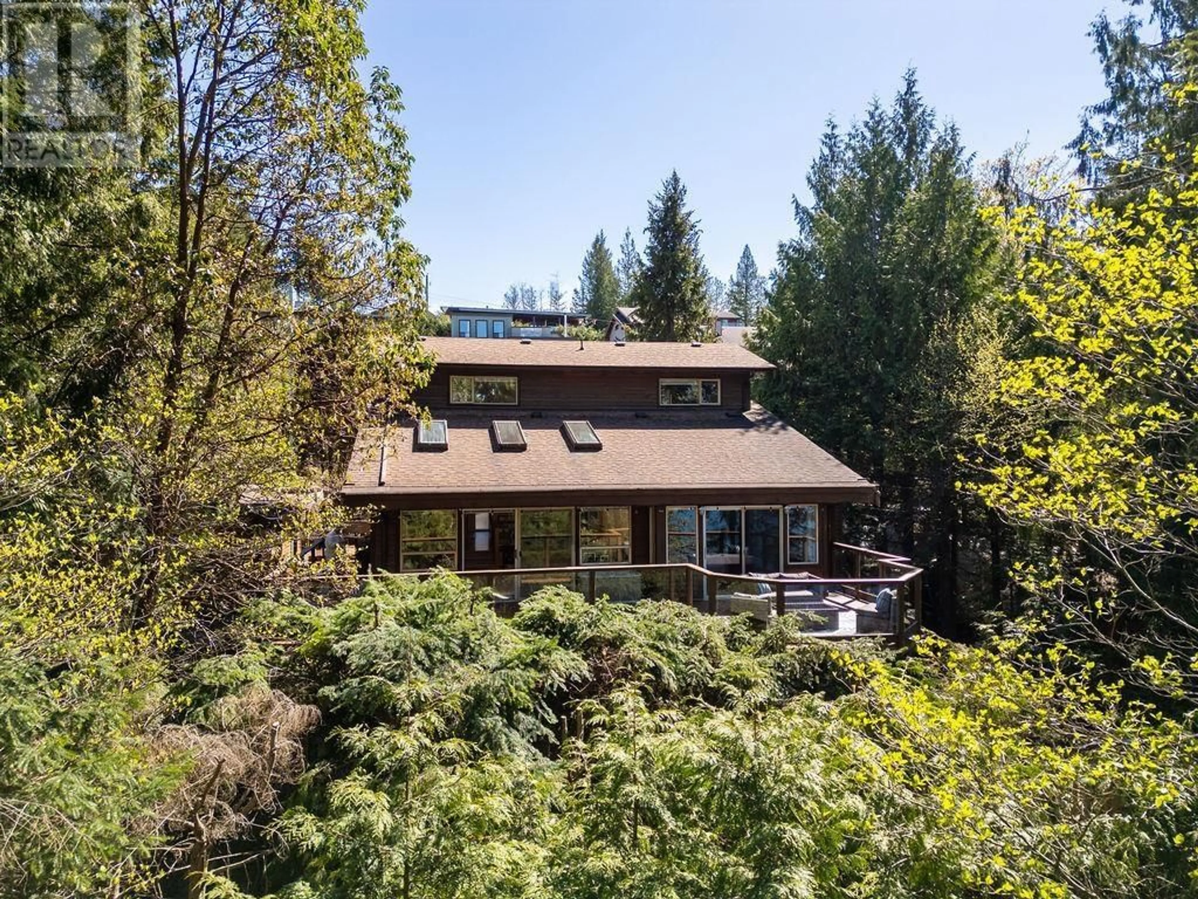 A pic from outside/outdoor area/front of a property/back of a property/a pic from drone, forest/trees view for 5864 SKOOKUMCHUK ROAD, Sechelt British Columbia V0N3A4
