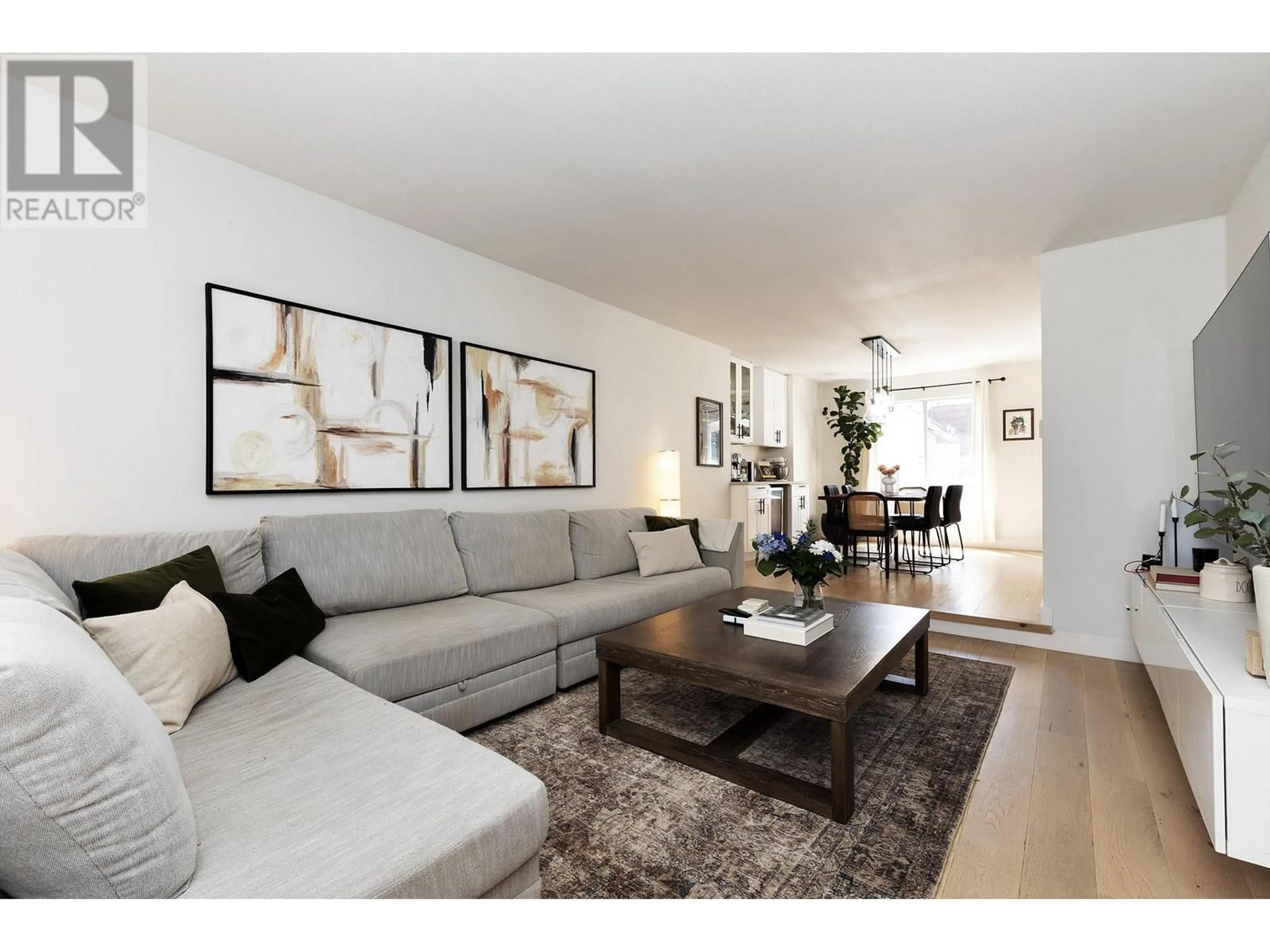 Living room with furniture, wood/laminate floor for 12028 CHESTNUT CRESCENT, Pitt Meadows British Columbia V3Y2L6