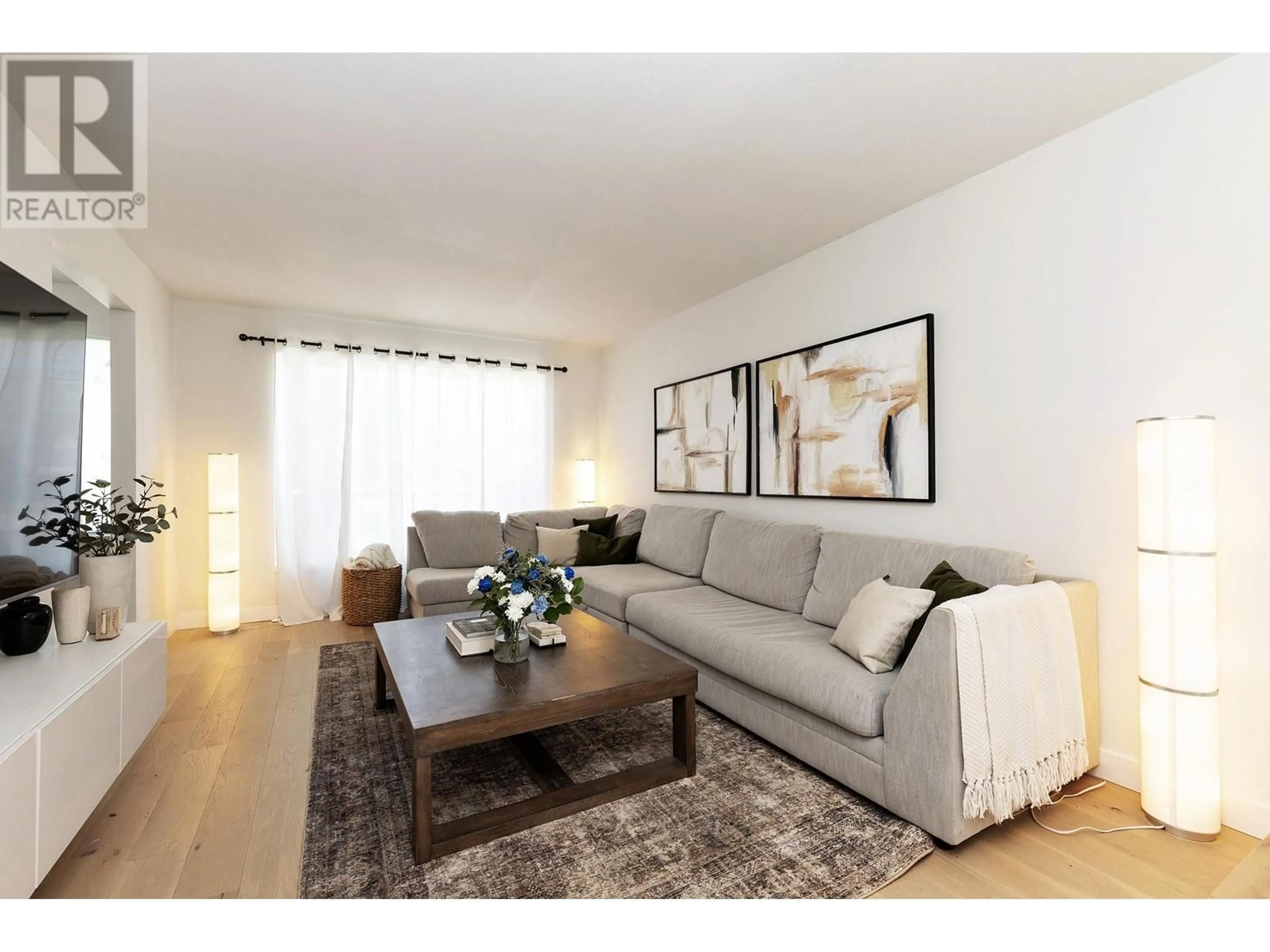 Living room with furniture, wood/laminate floor for 12028 CHESTNUT CRESCENT, Pitt Meadows British Columbia V3Y2L6