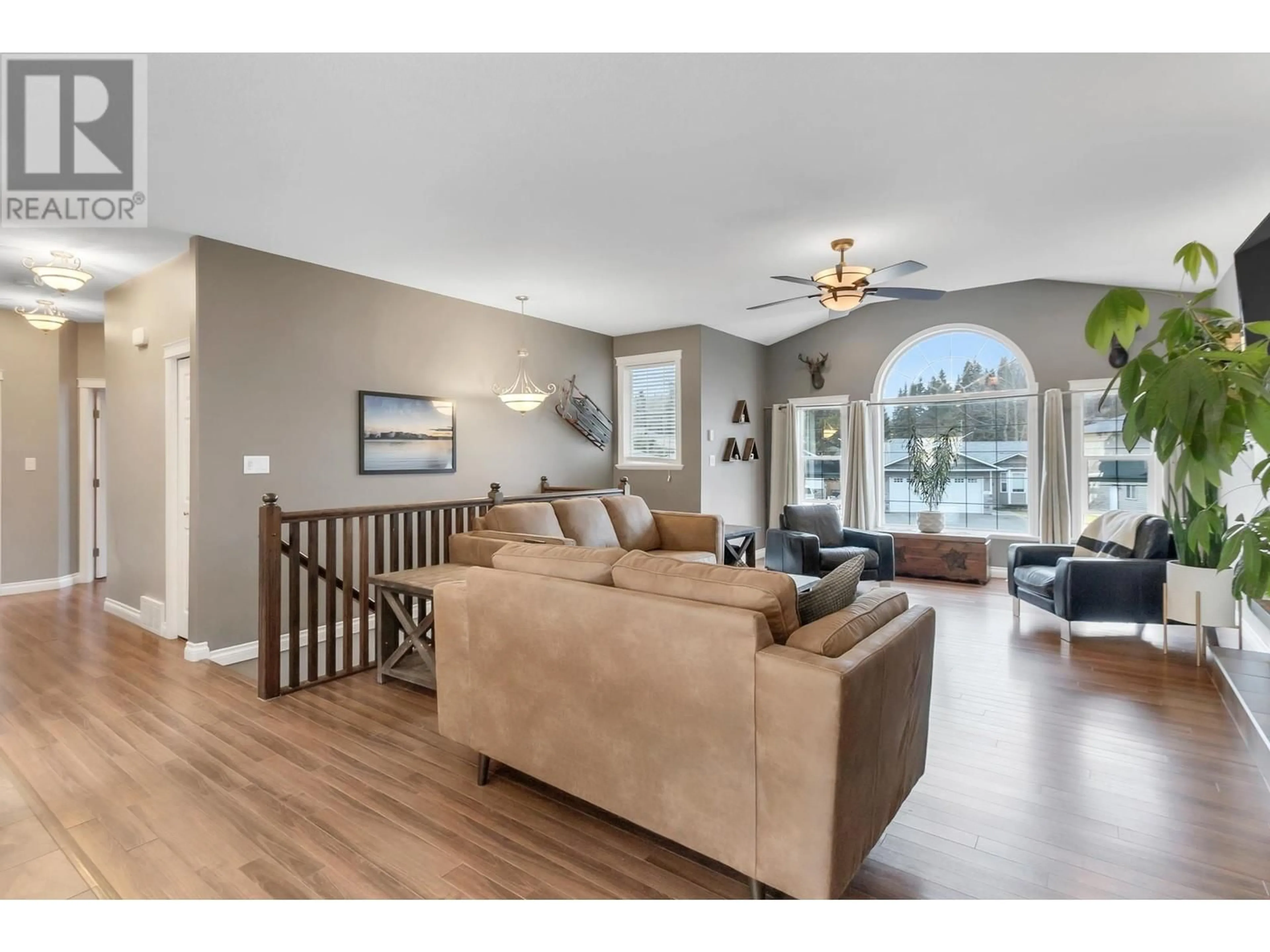 Living room with furniture, wood/laminate floor for 6239 MONTEREY ROAD, Prince George British Columbia V2K5G7