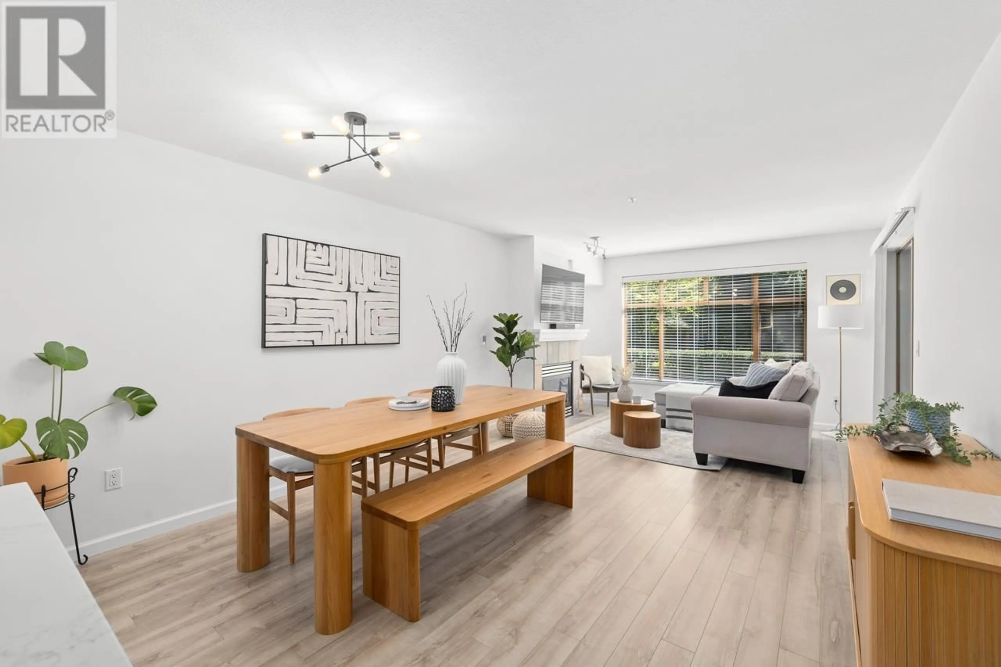 Living room with furniture, wood/laminate floor for 103 - 285 NEWPORT DRIVE, Port Moody British Columbia V3H5J6