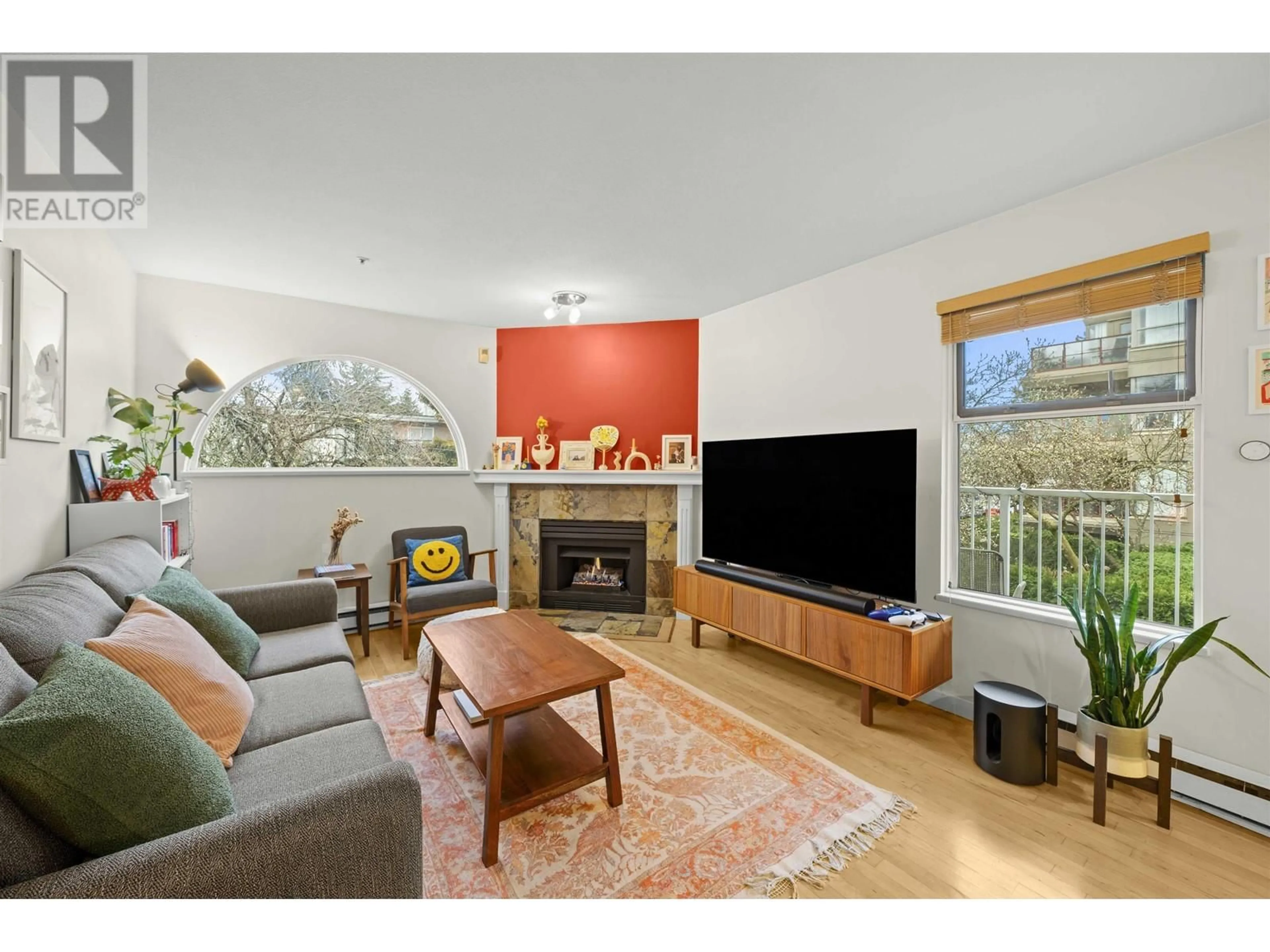 Living room with furniture, wood/laminate floor for 201 - 1868 8TH AVENUE, Vancouver British Columbia V6J5G3