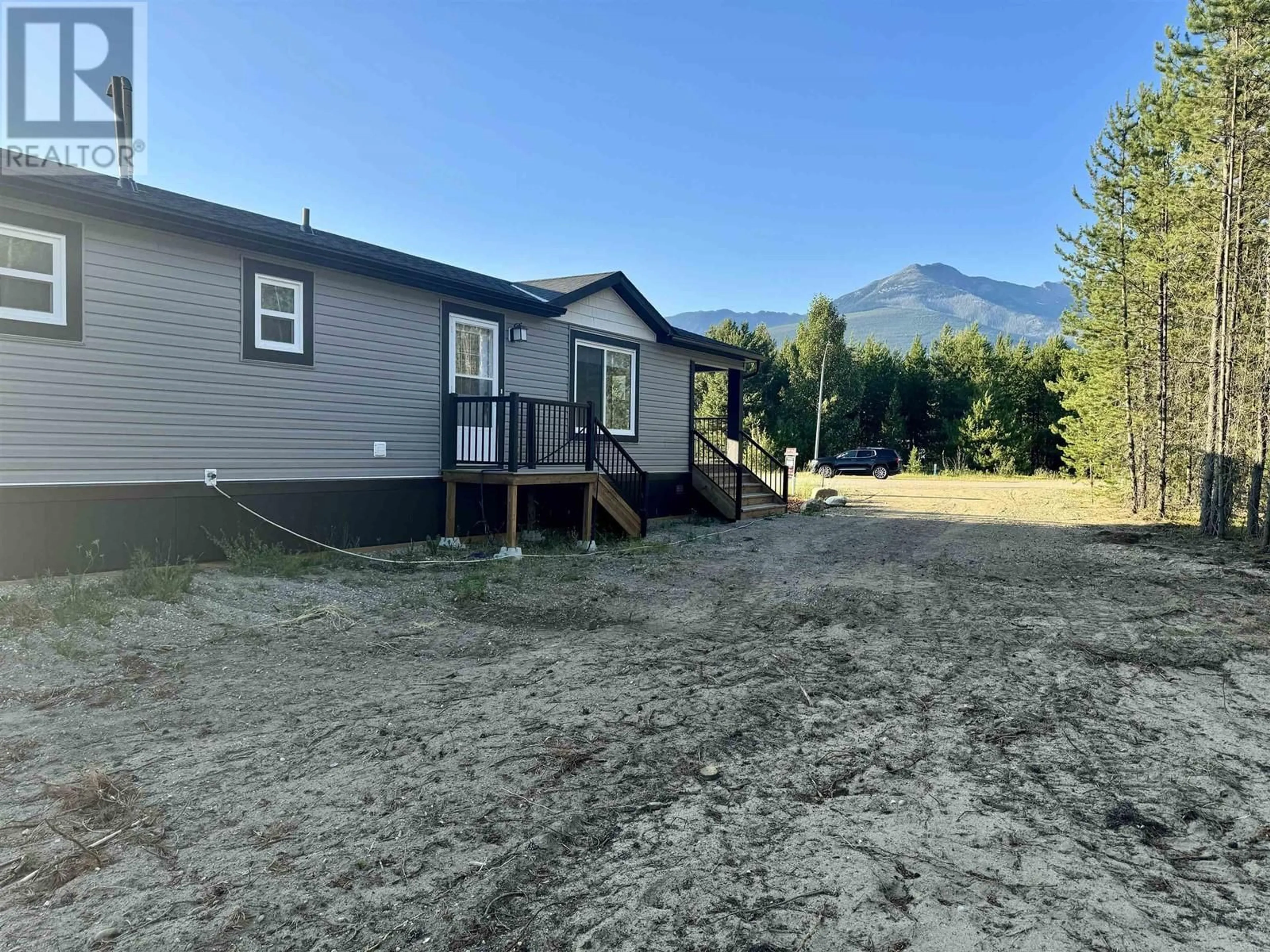 A pic from outside/outdoor area/front of a property/back of a property/a pic from drone, mountain view for 1471 8TH PLACE, Valemount British Columbia V0E2Z0