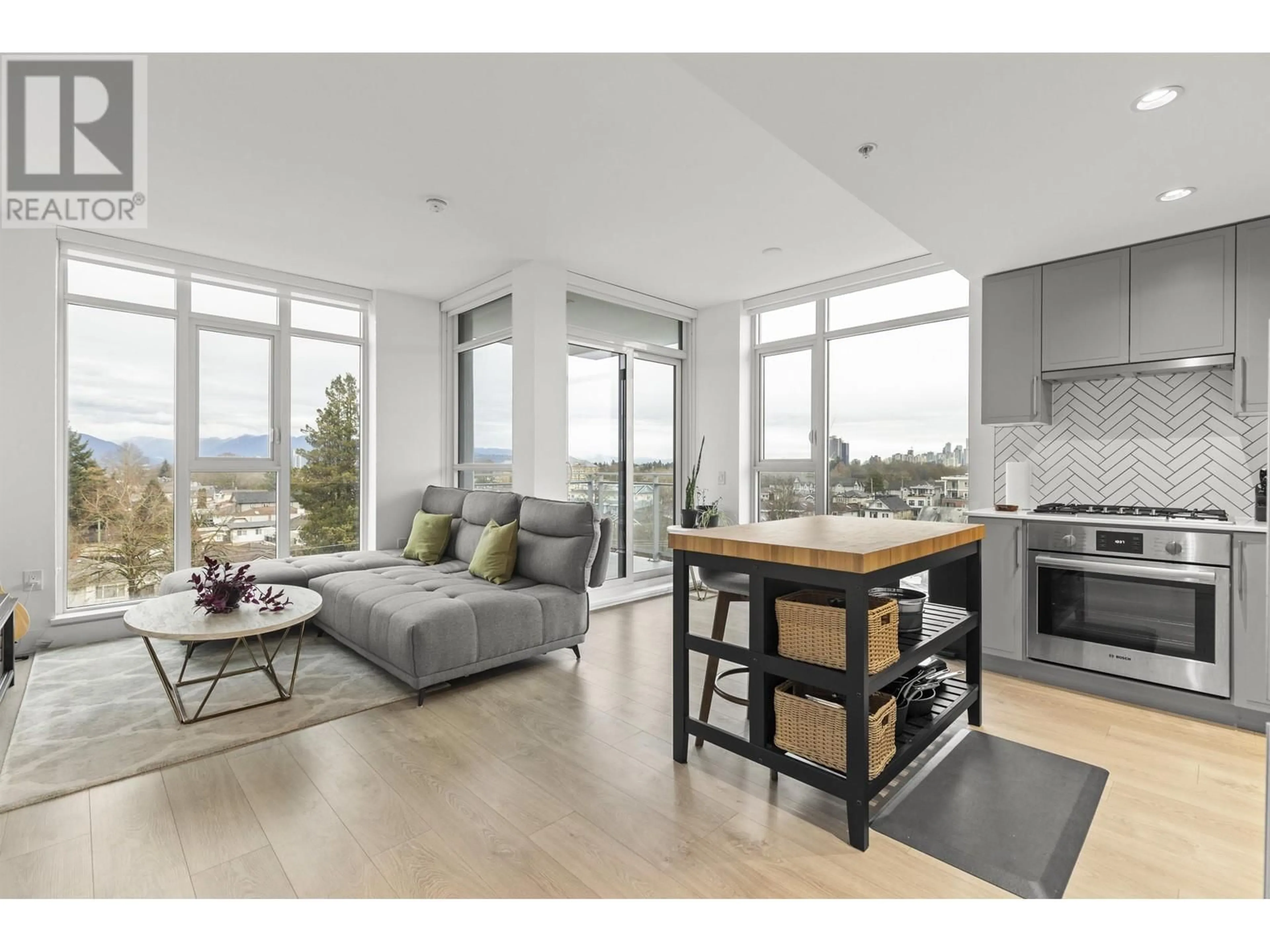 Open concept kitchen, wood/laminate floor for 601 - 2435 KINGSWAY, Vancouver British Columbia V5R5G8