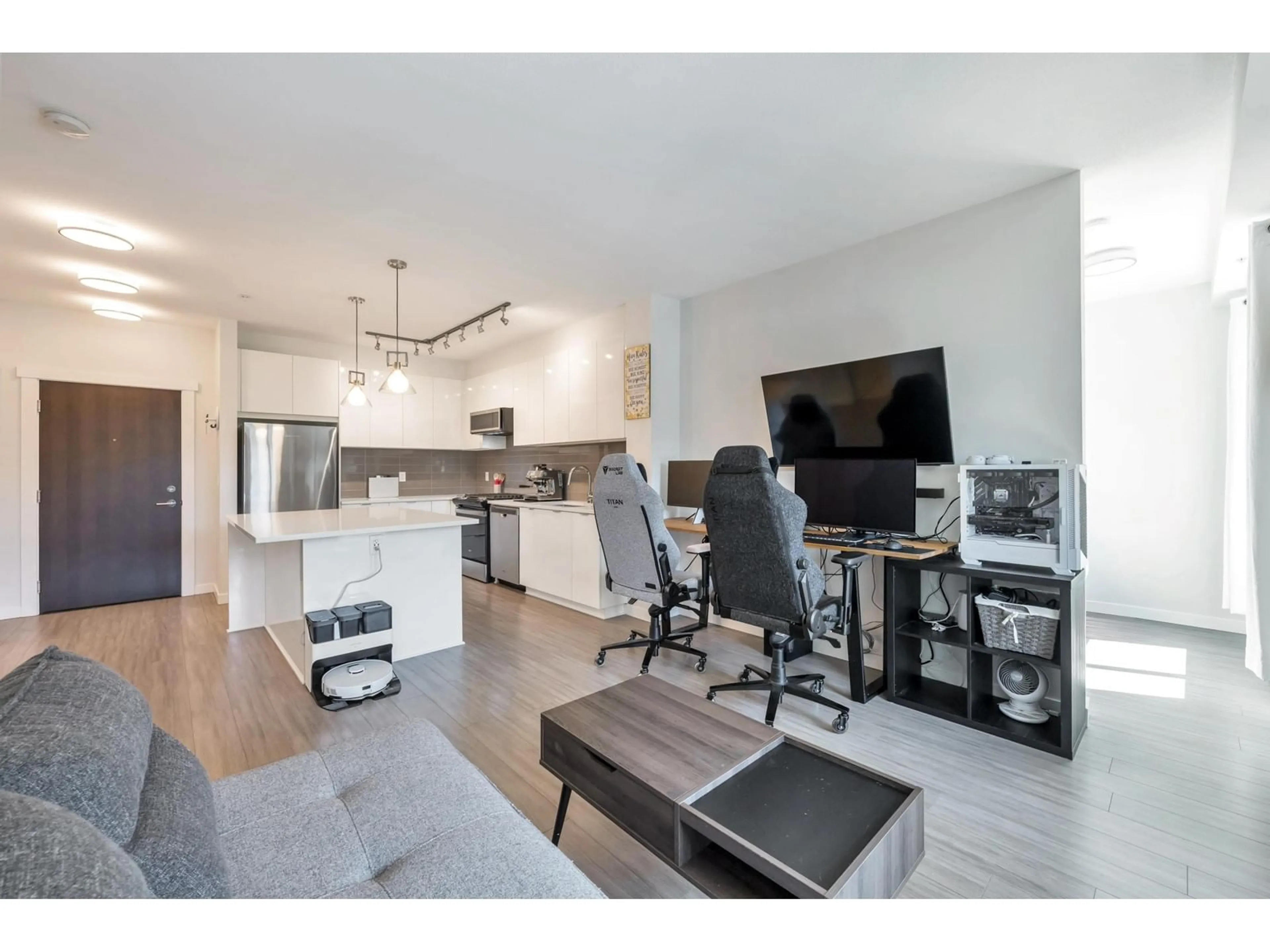 Living room with furniture, wood/laminate floor for B222 - 8150 207, Langley British Columbia V2Y4J3