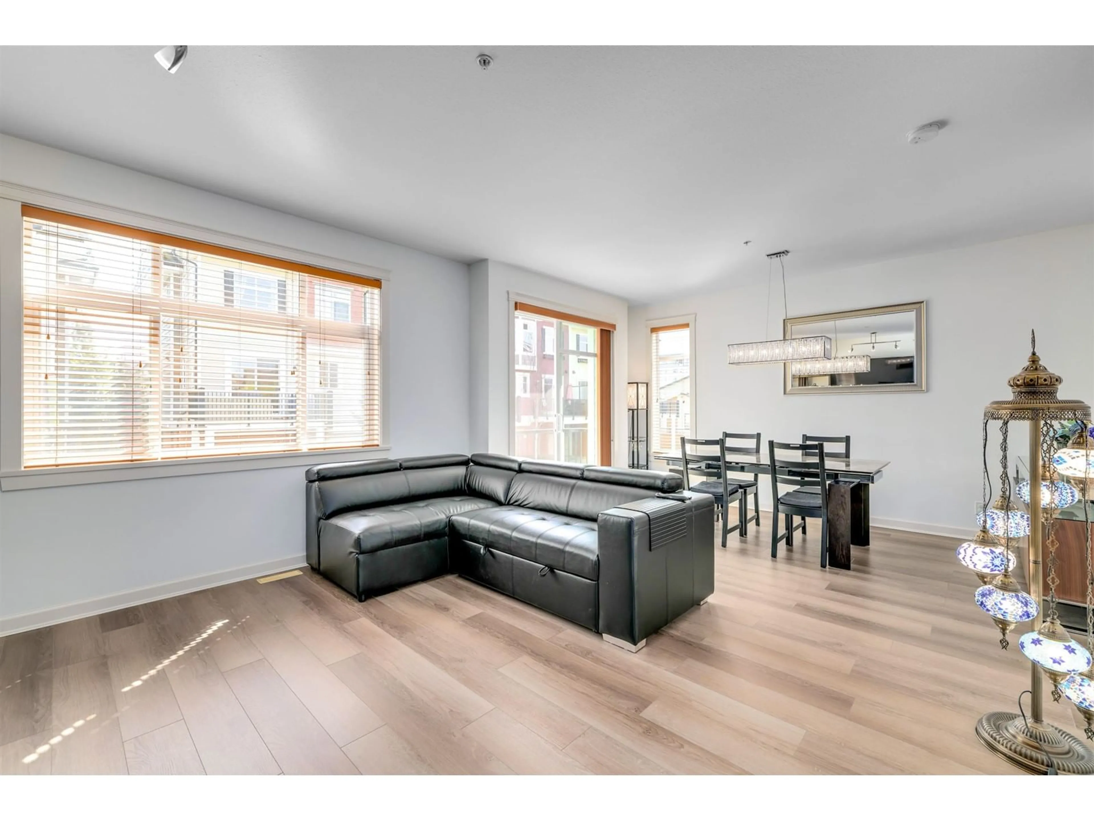 Living room with furniture, wood/laminate floor for 126 - 8068 207, Langley British Columbia V2Y0M9