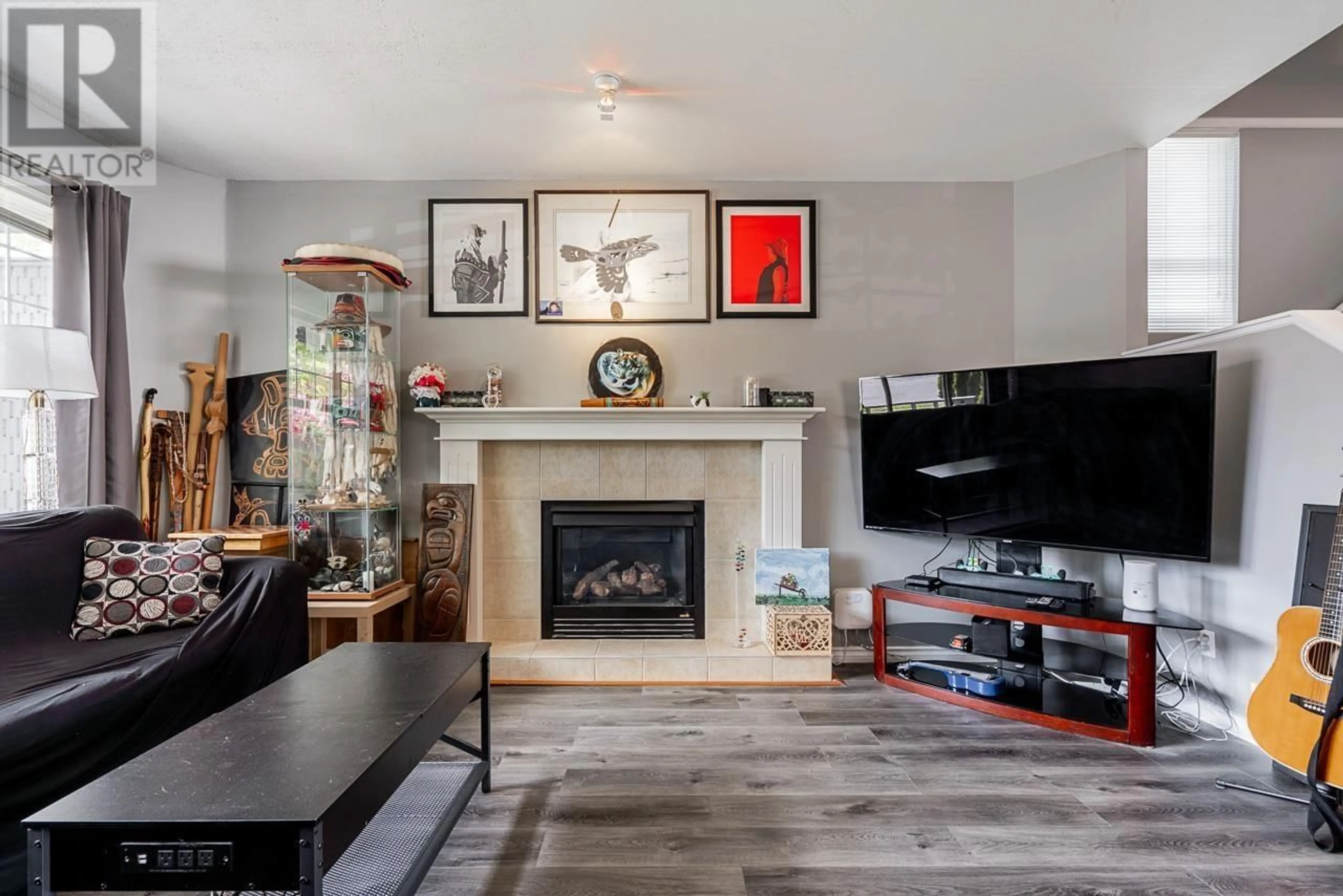 Living room with furniture, wood/laminate floor for 24347 102 AVENUE, Maple Ridge British Columbia V2W1X9