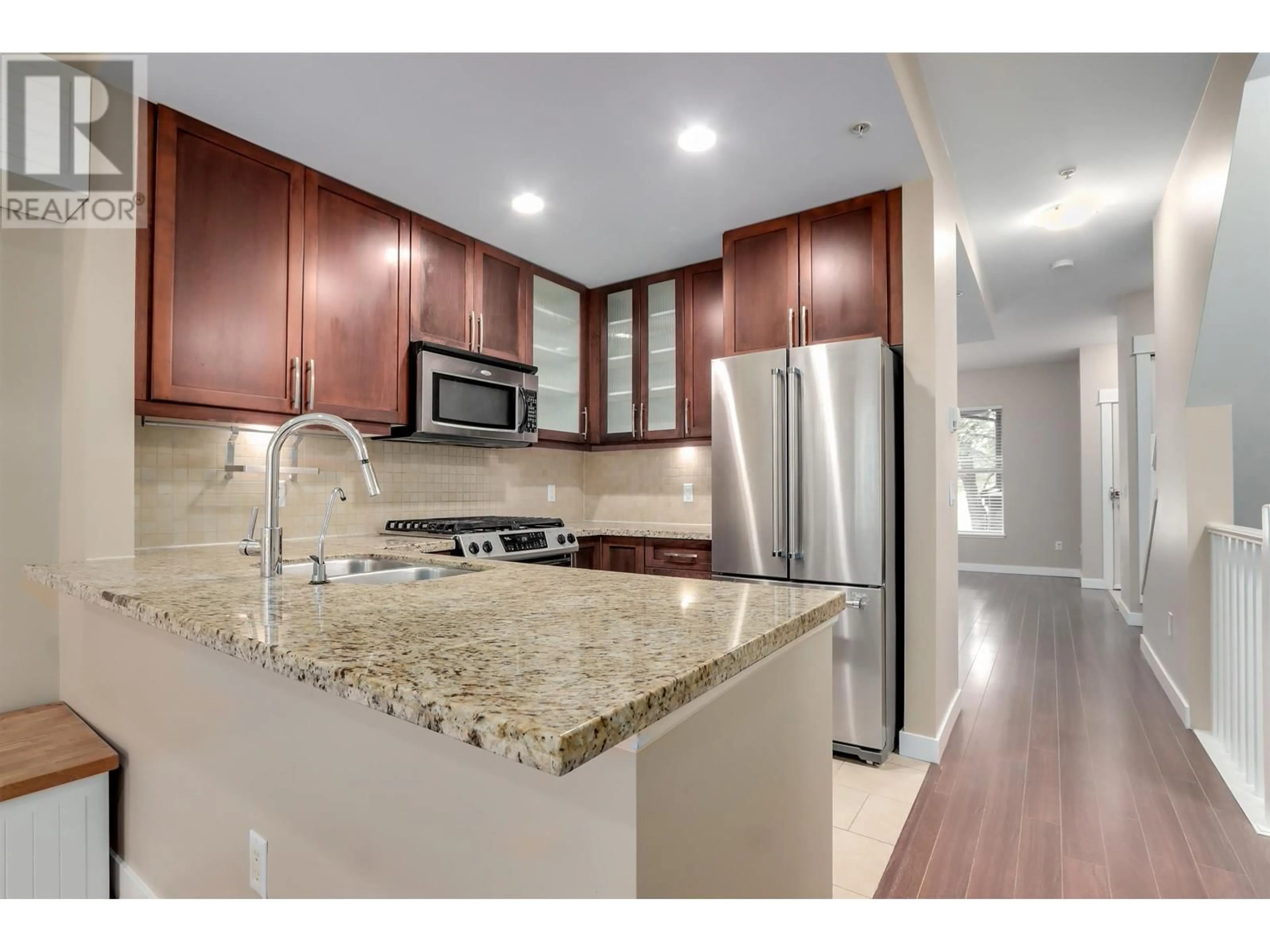 Open concept kitchen, ceramic/tile floor for 319 15 STREET, North Vancouver British Columbia V7L2R6