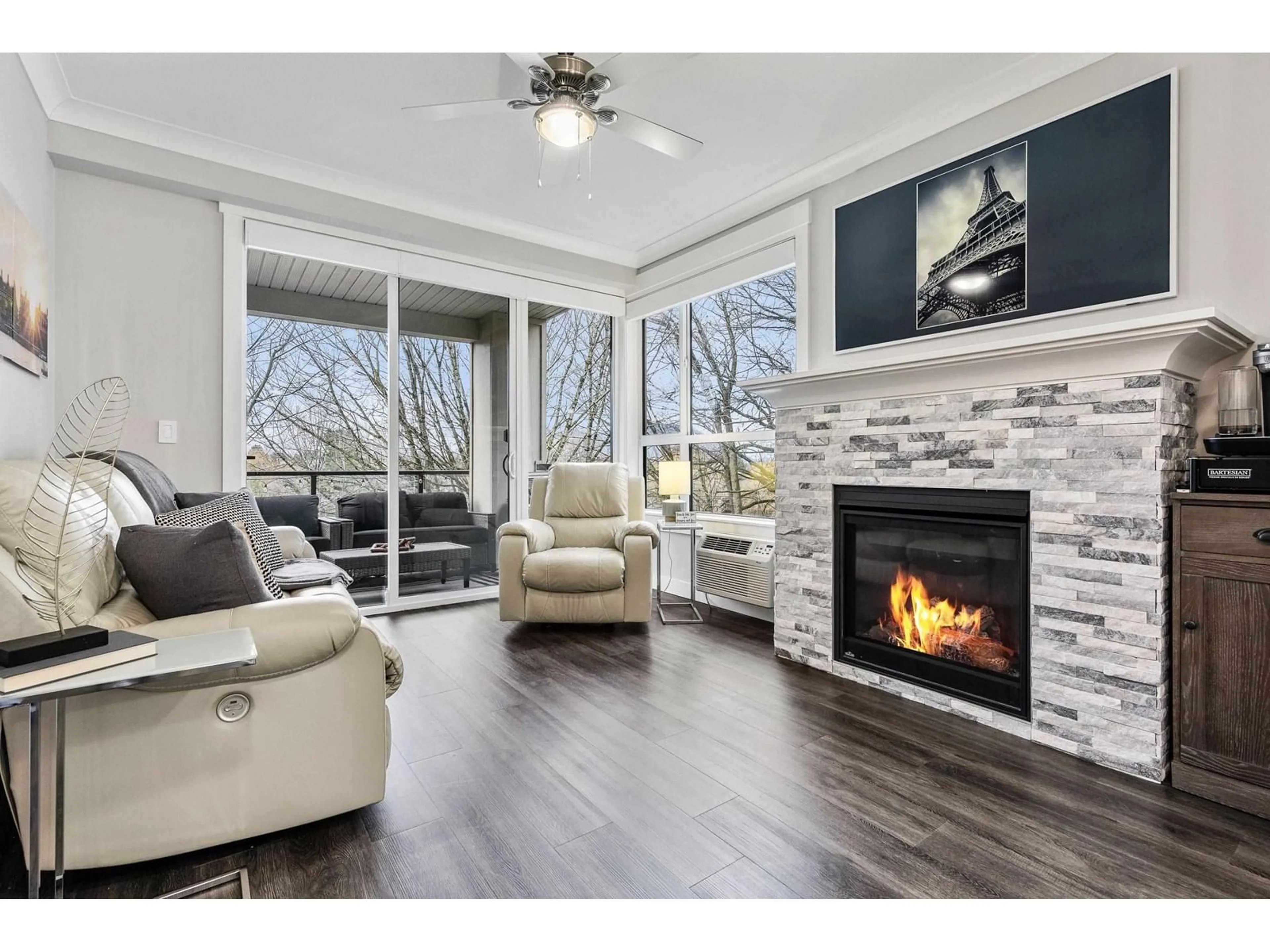 Living room with furniture, wood/laminate floor for 309 - 45761 STEVENSON ROAD, Chilliwack British Columbia V2R0Y7