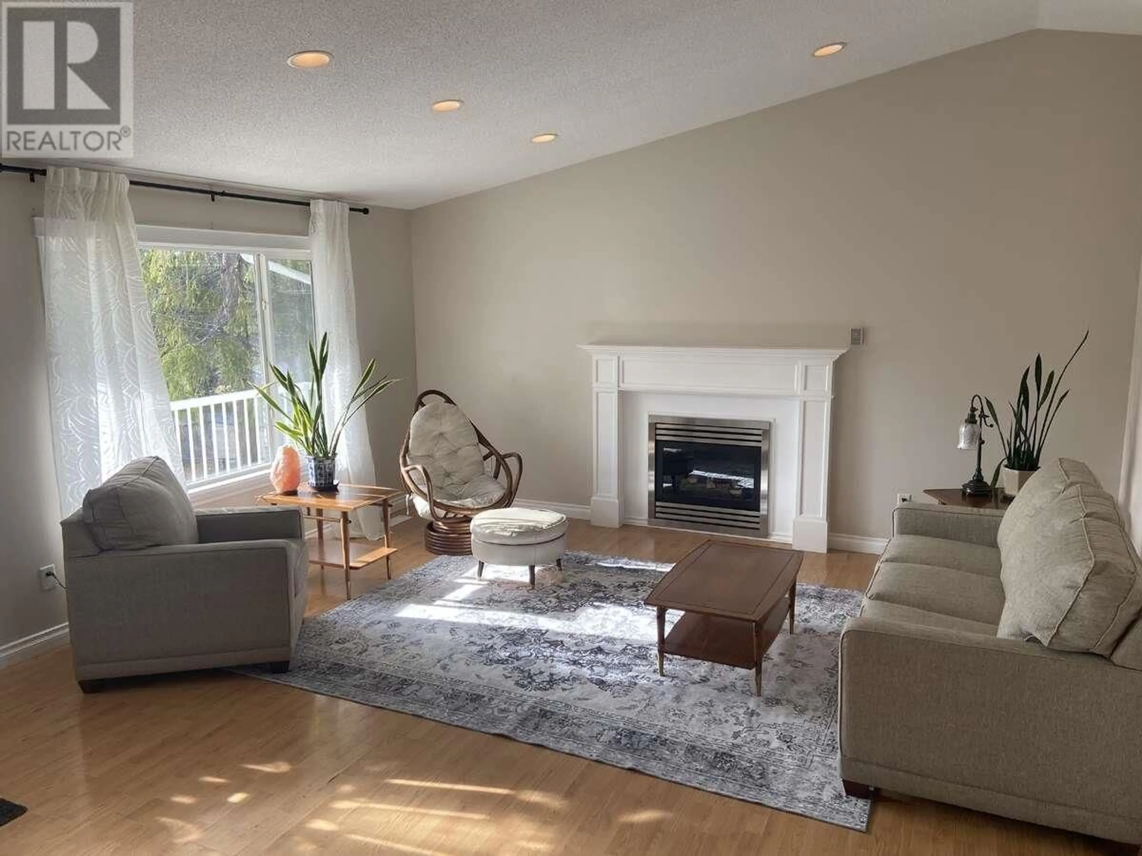 Living room with furniture, wood/laminate floor for 7941 ROSEWOOD PLACE, Prince George British Columbia V2N5M9