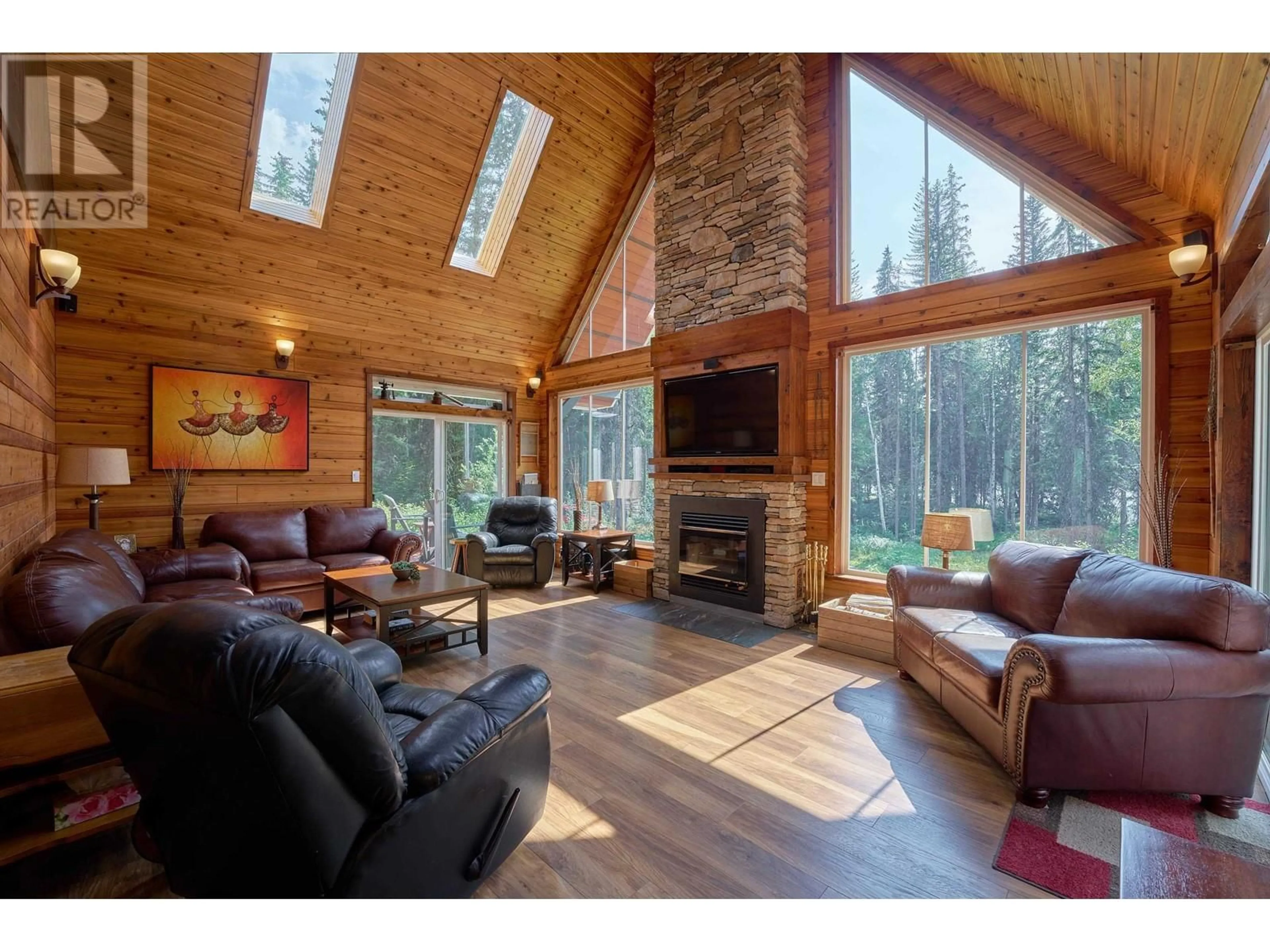 Living room with furniture, wood/laminate floor for 6777 MCKINLEY TRAIL, Horsefly British Columbia V0L1L0
