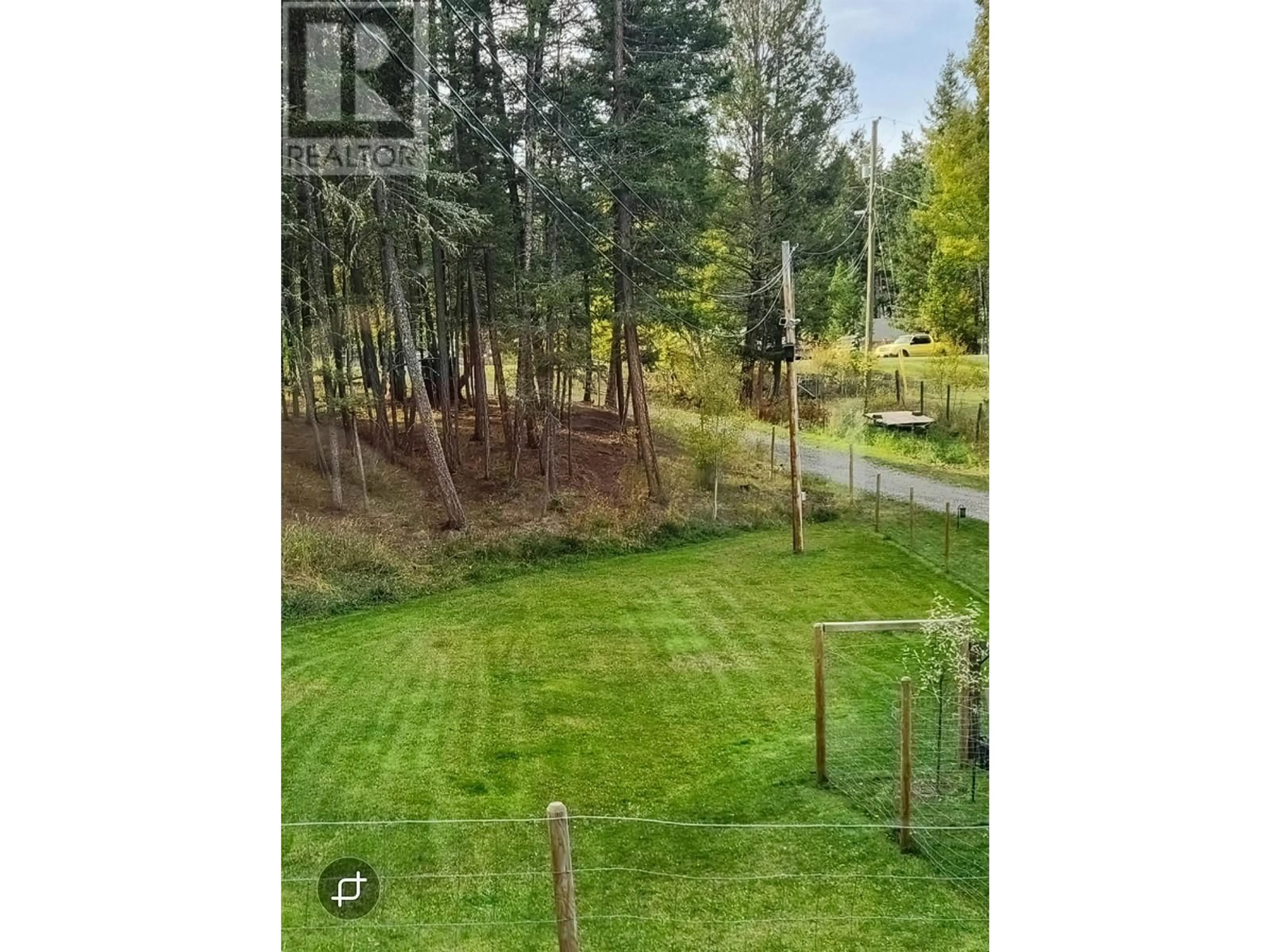 A pic from outside/outdoor area/front of a property/back of a property/a pic from drone, forest/trees view for 4911 PEASIM COURT, 108 Mile Ranch British Columbia V0K2Z0