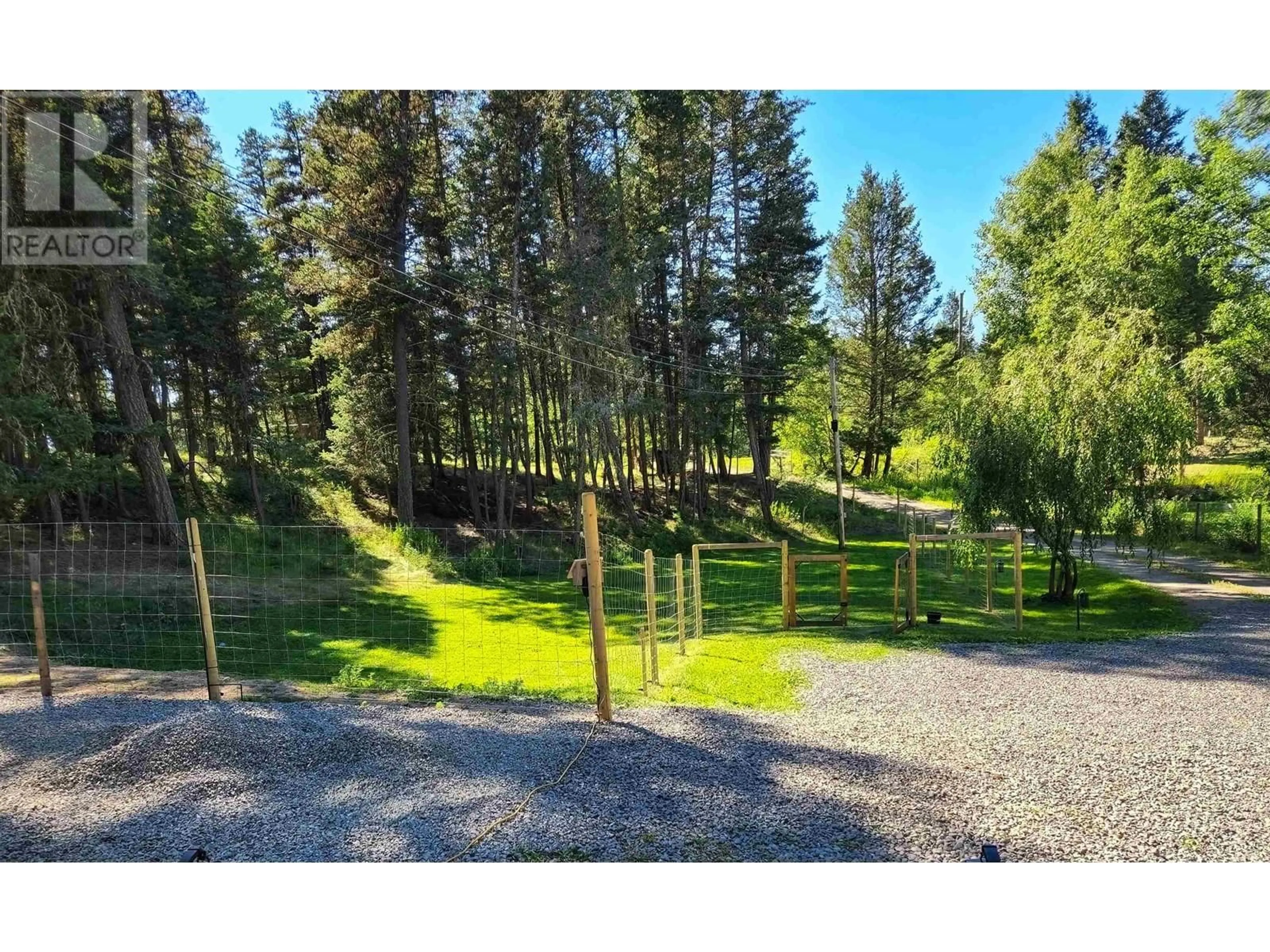 A pic from outside/outdoor area/front of a property/back of a property/a pic from drone, forest/trees view for 4911 PEASIM COURT, 108 Mile Ranch British Columbia V0K2Z0
