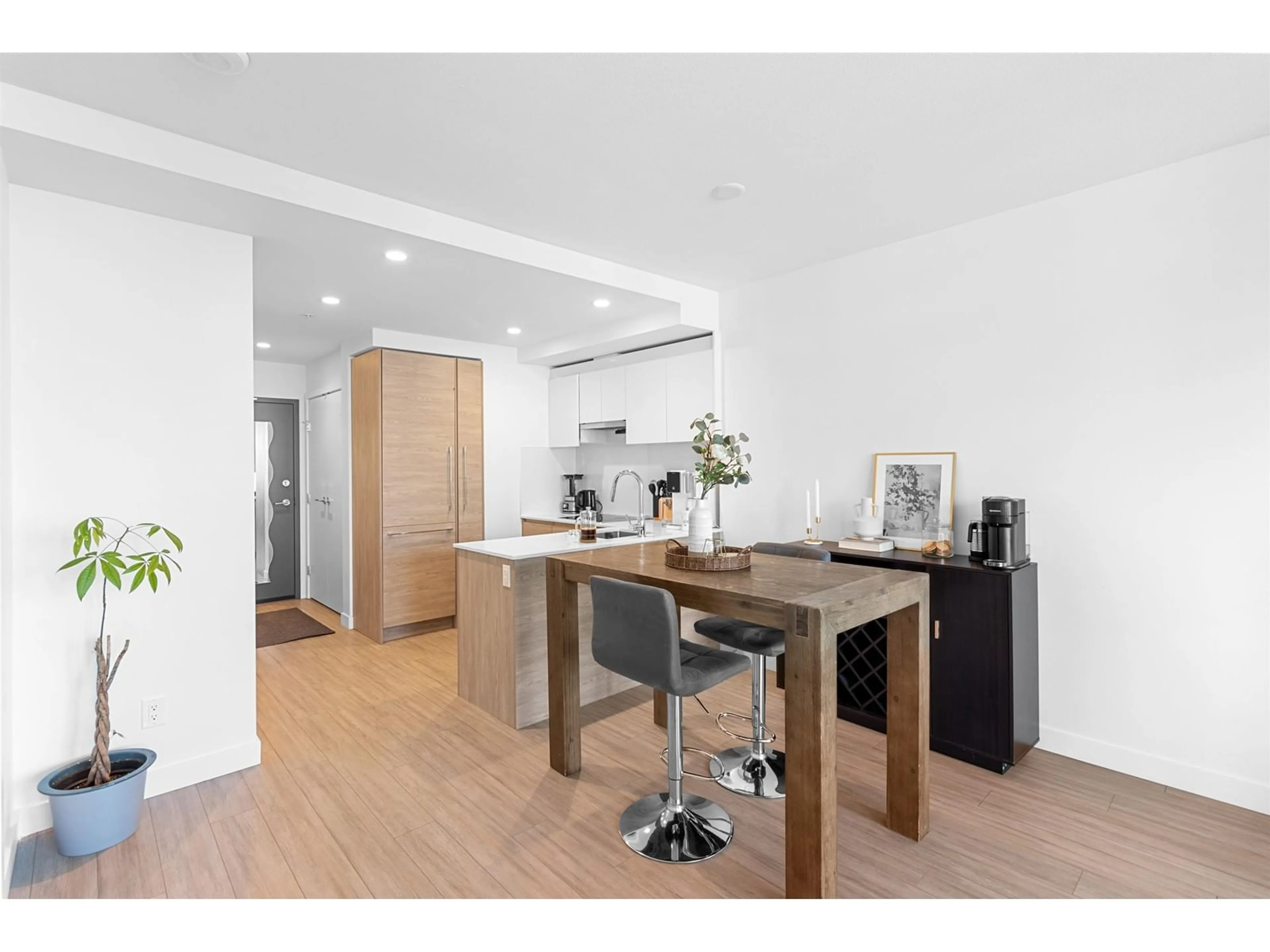 Open concept kitchen, wood/laminate floor for 2308 - 13615 FRASER, Surrey British Columbia V3T0P7
