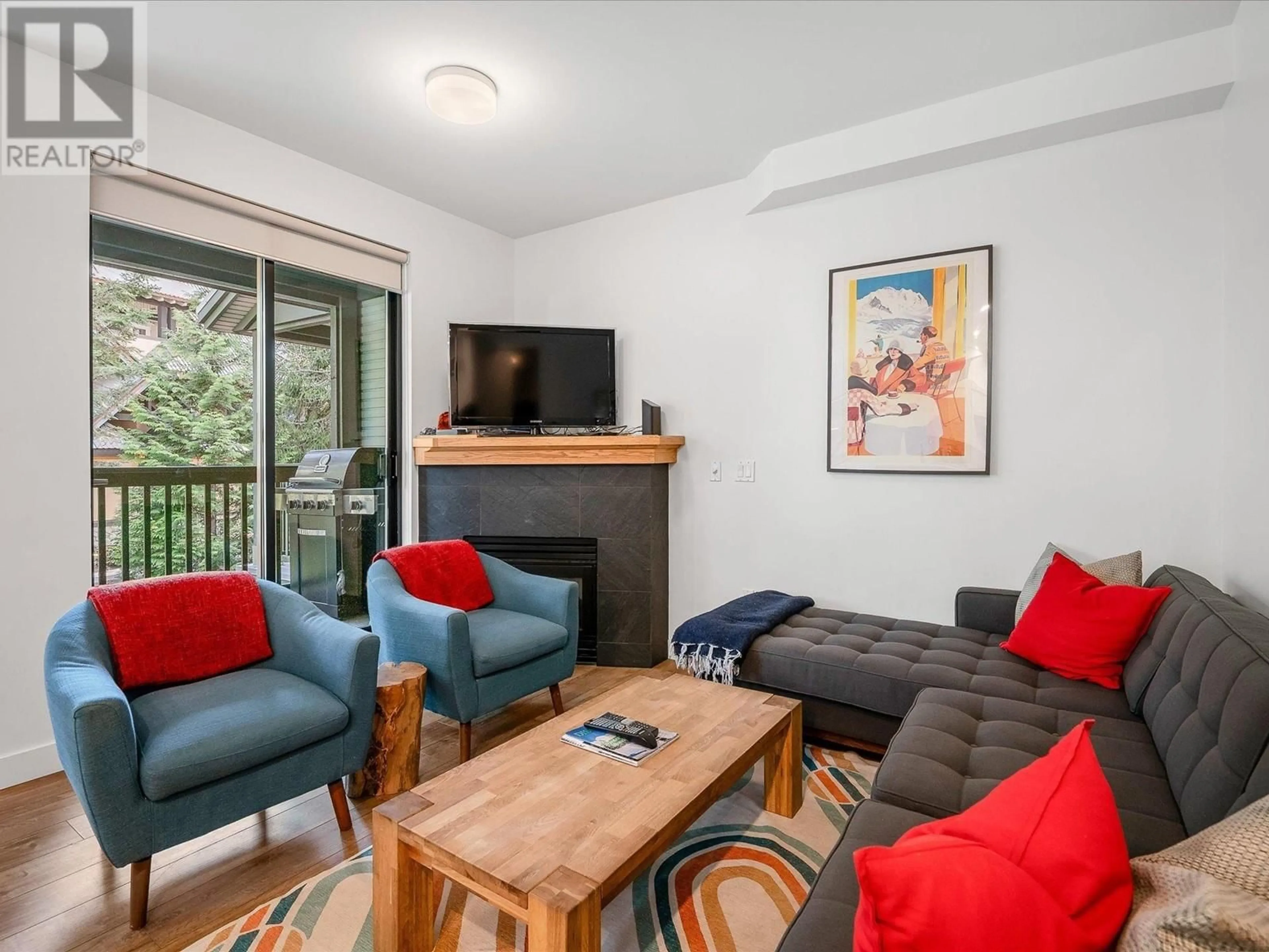Living room with furniture, wood/laminate floor for 28 - 4355 NORTHLANDS BOULEVARD, Whistler British Columbia V8E1C3