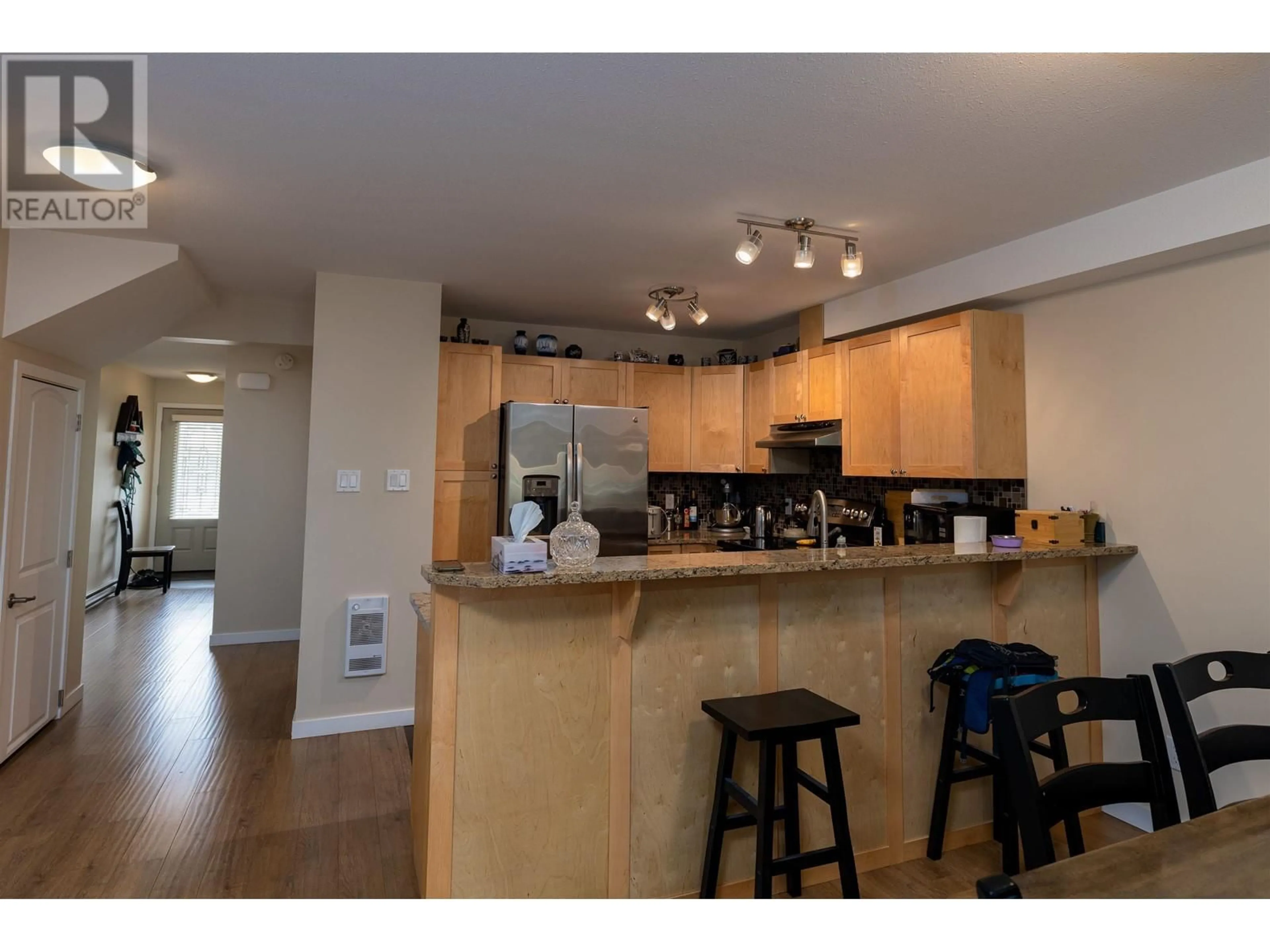 Open concept kitchen, wood/laminate floor for 107 - 4719 DAVIS AVENUE, Terrace British Columbia V8G1Y1