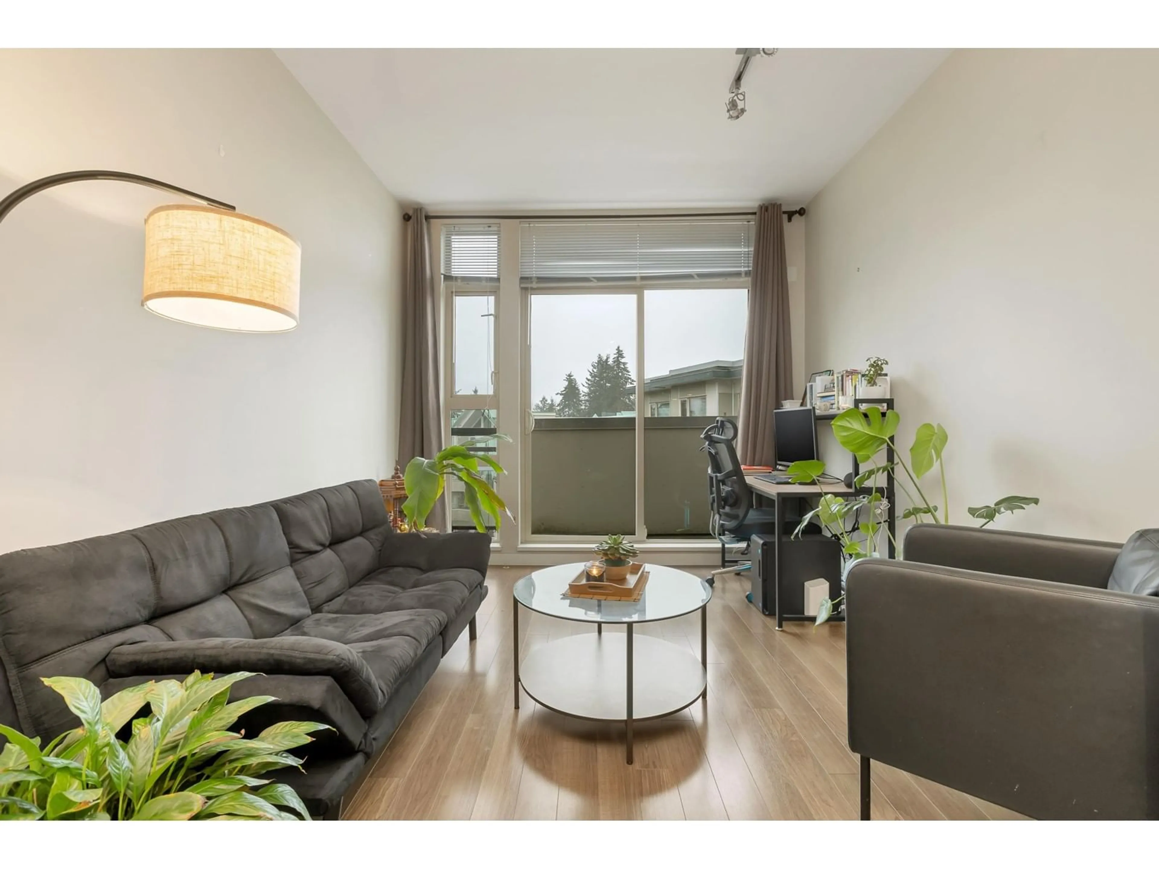 Living room with furniture, wood/laminate floor for 420 - 13228 OLD YALE, Surrey British Columbia V3T0K3