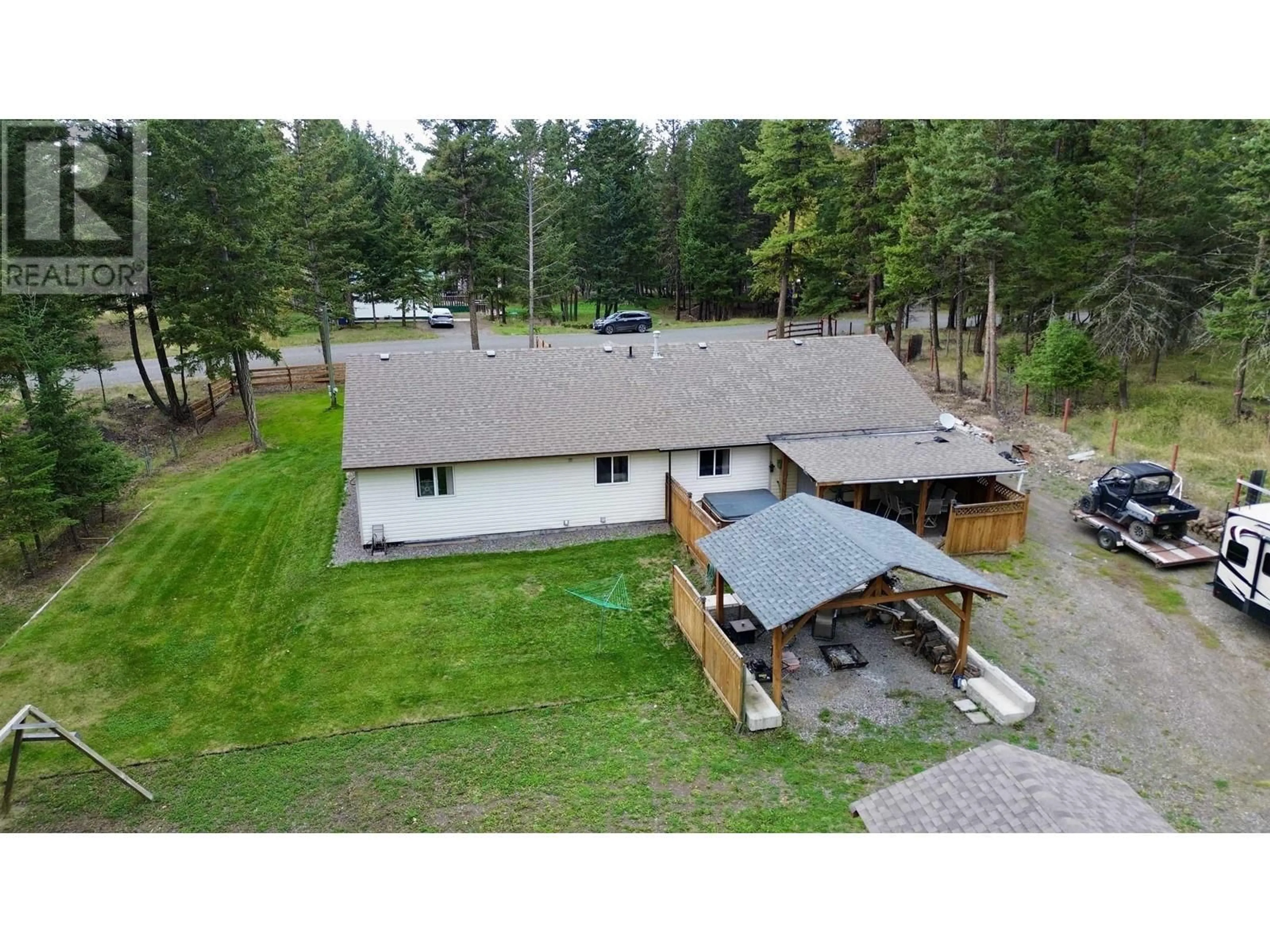 A pic from outside/outdoor area/front of a property/back of a property/a pic from drone, unknown for 4837 GLOINNZUN DRIVE, 108 Mile Ranch British Columbia V0K2E1