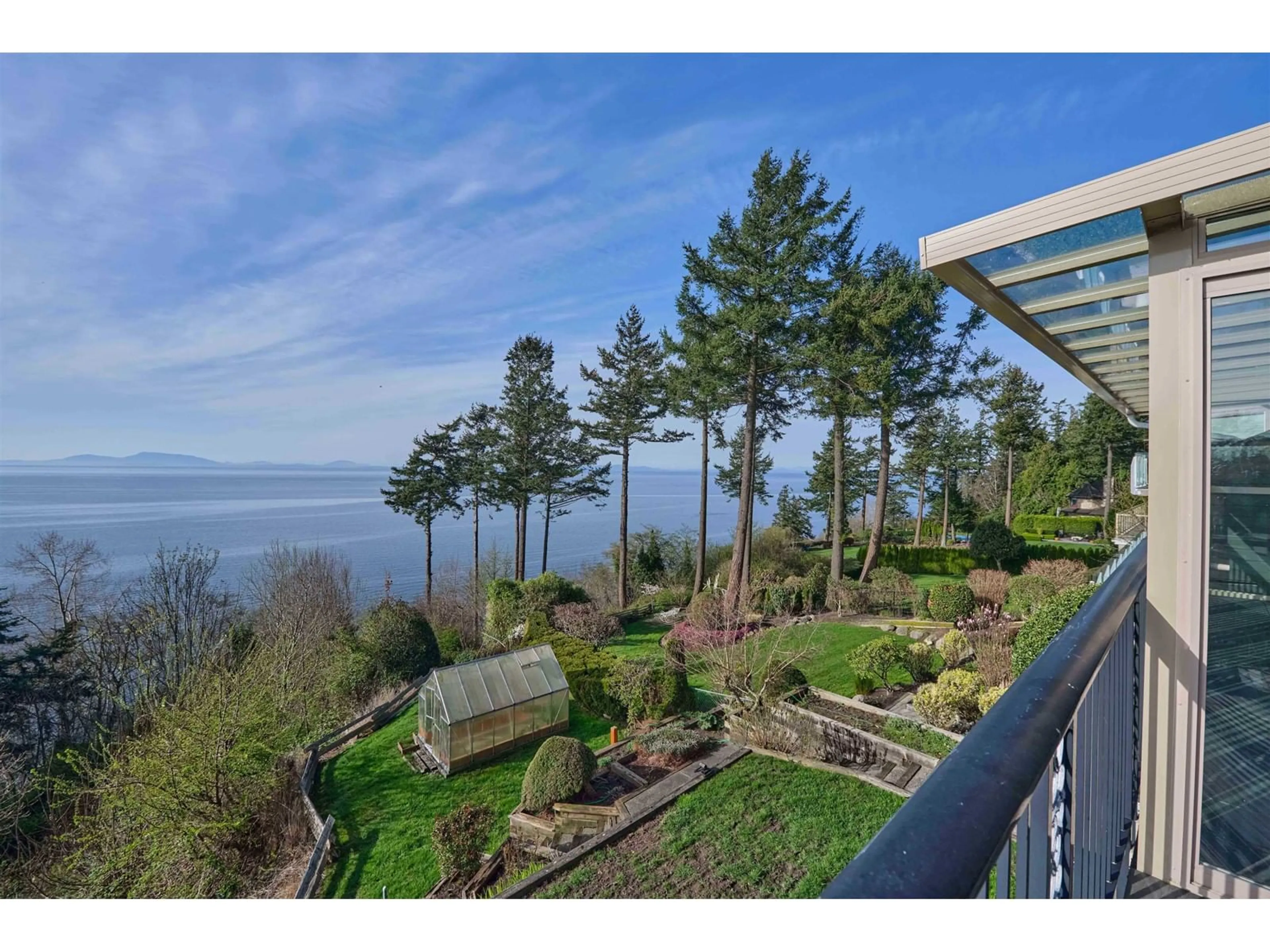 A pic from outside/outdoor area/front of a property/back of a property/a pic from drone, water/lake/river/ocean view for 13026 13, Surrey British Columbia V4A1B8