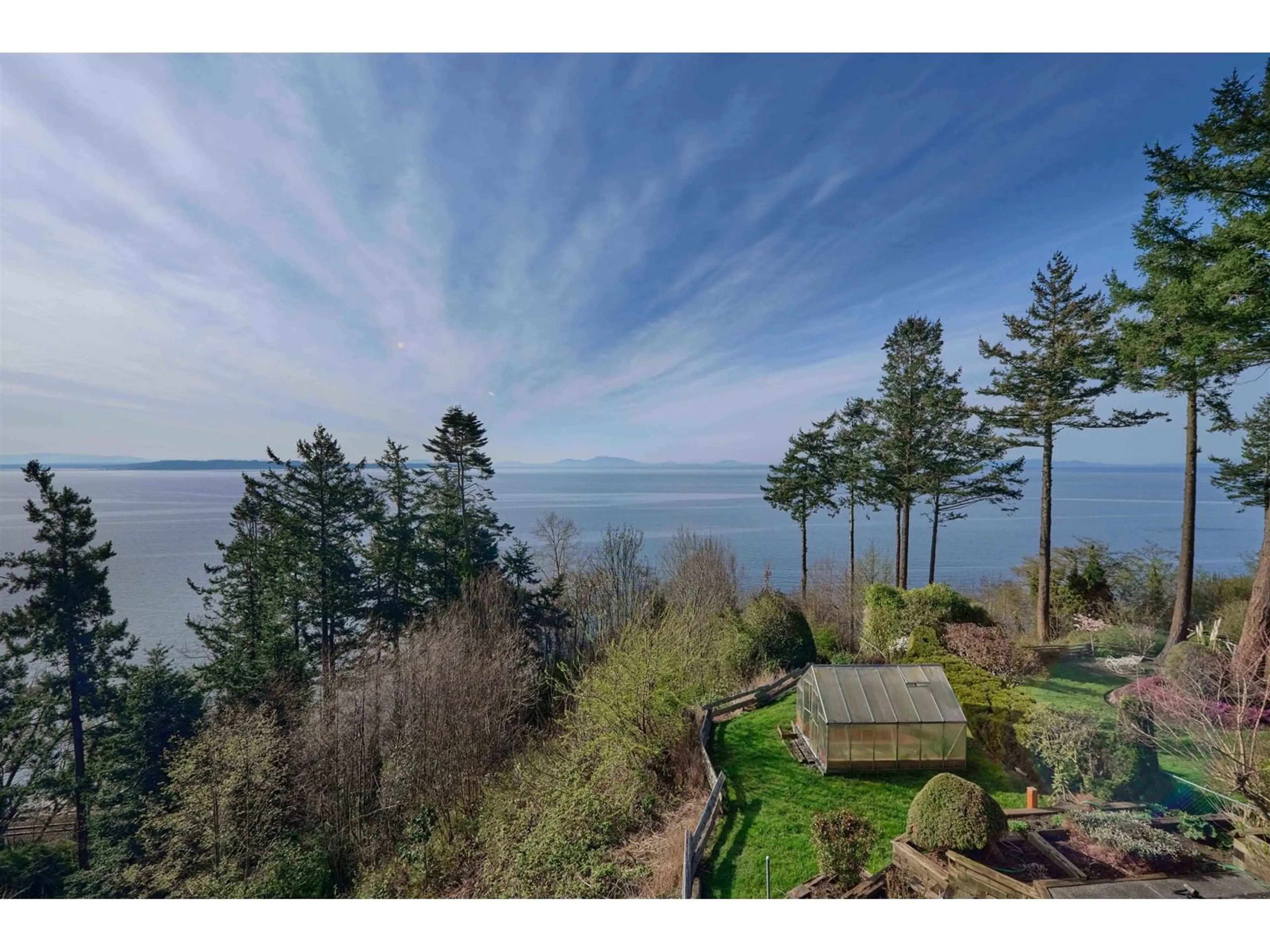 A pic from outside/outdoor area/front of a property/back of a property/a pic from drone, water/lake/river/ocean view for 13026 13, Surrey British Columbia V4A1B8