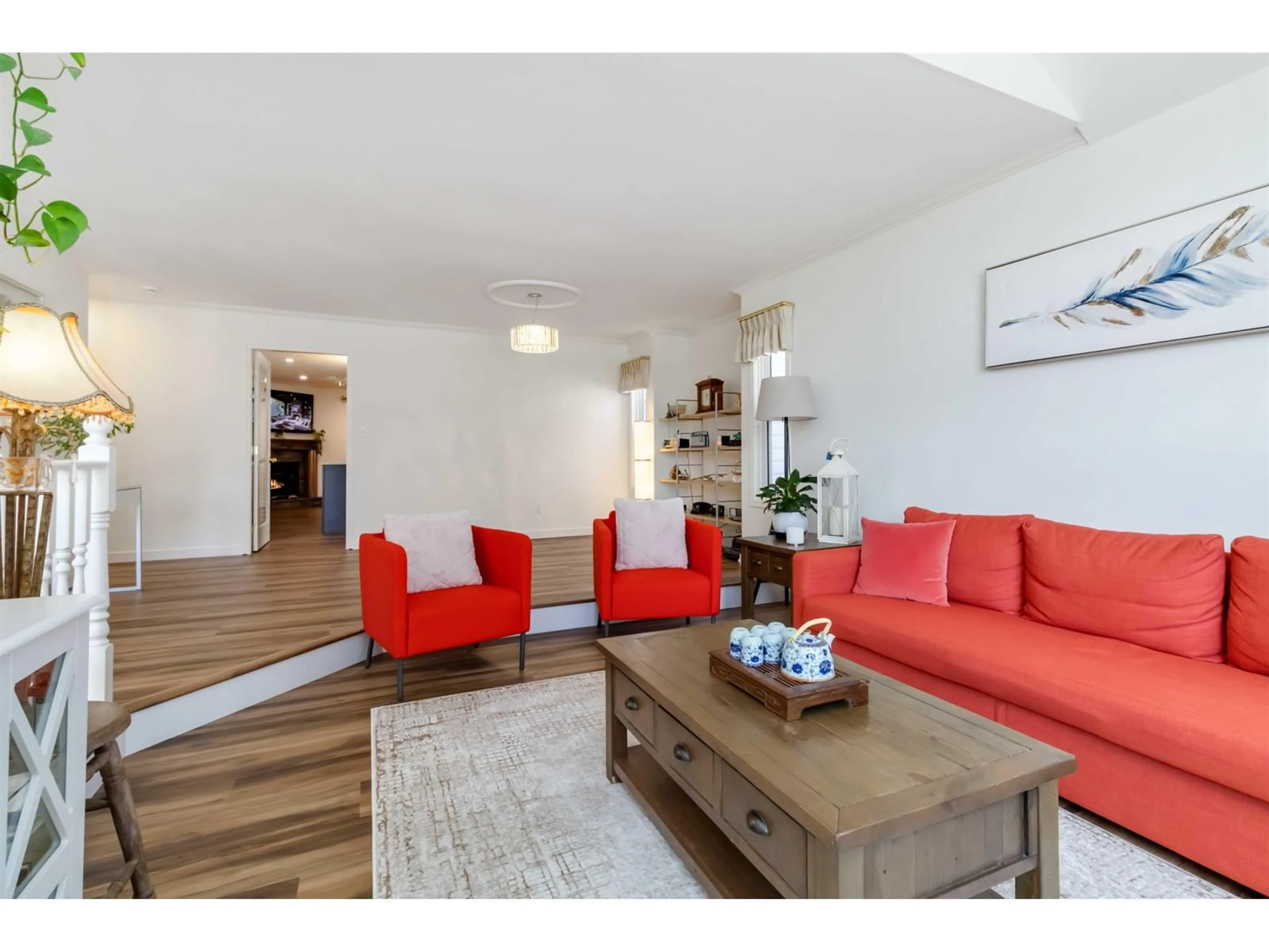 Living room with furniture, wood/laminate floor for 7265 MEADOWLARK STREET, Chilliwack British Columbia V2R2X1