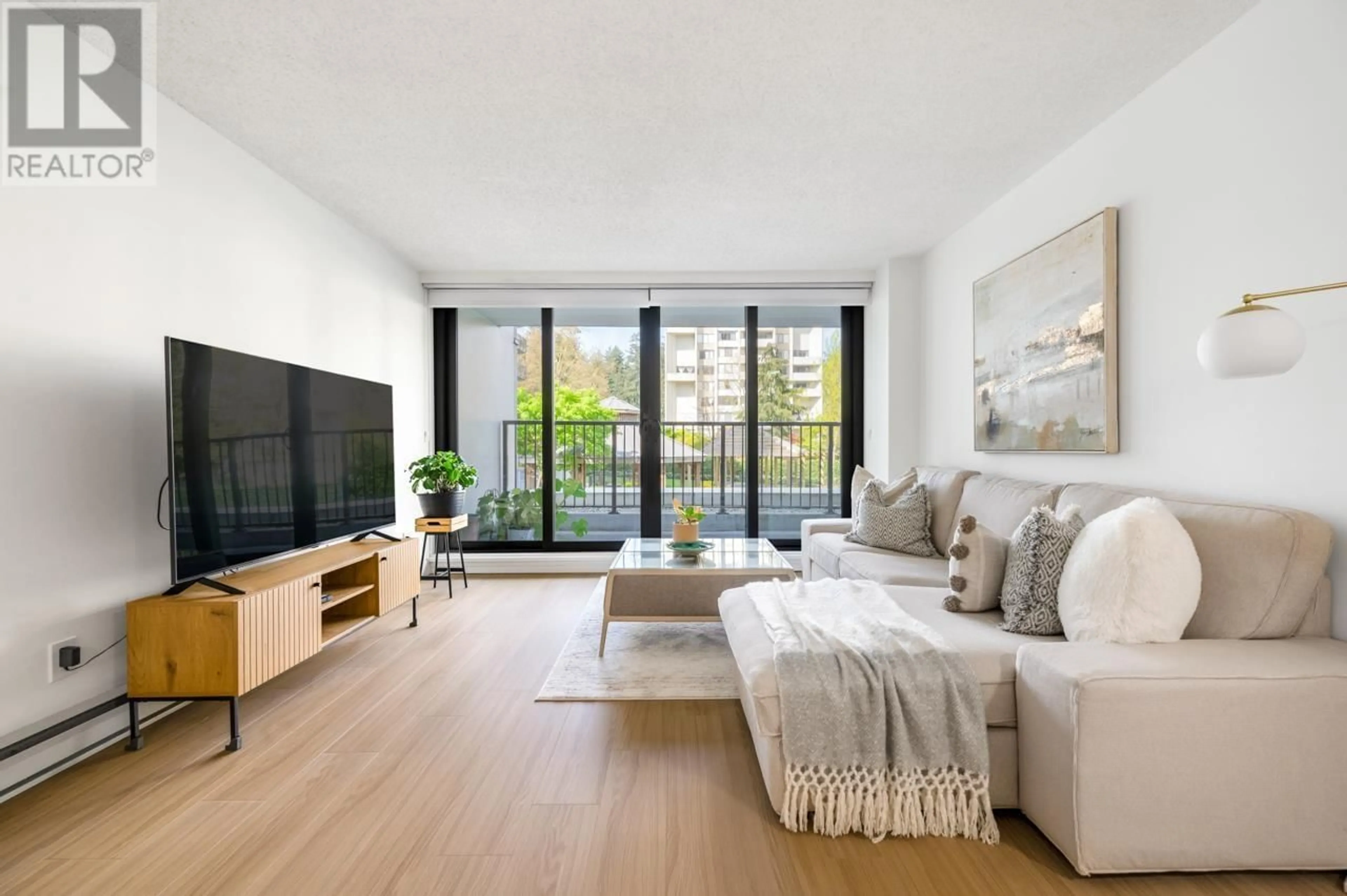 Living room with furniture, wood/laminate floor for 201 - 6455 WILLINGDON AVENUE, Burnaby British Columbia V5H4E4