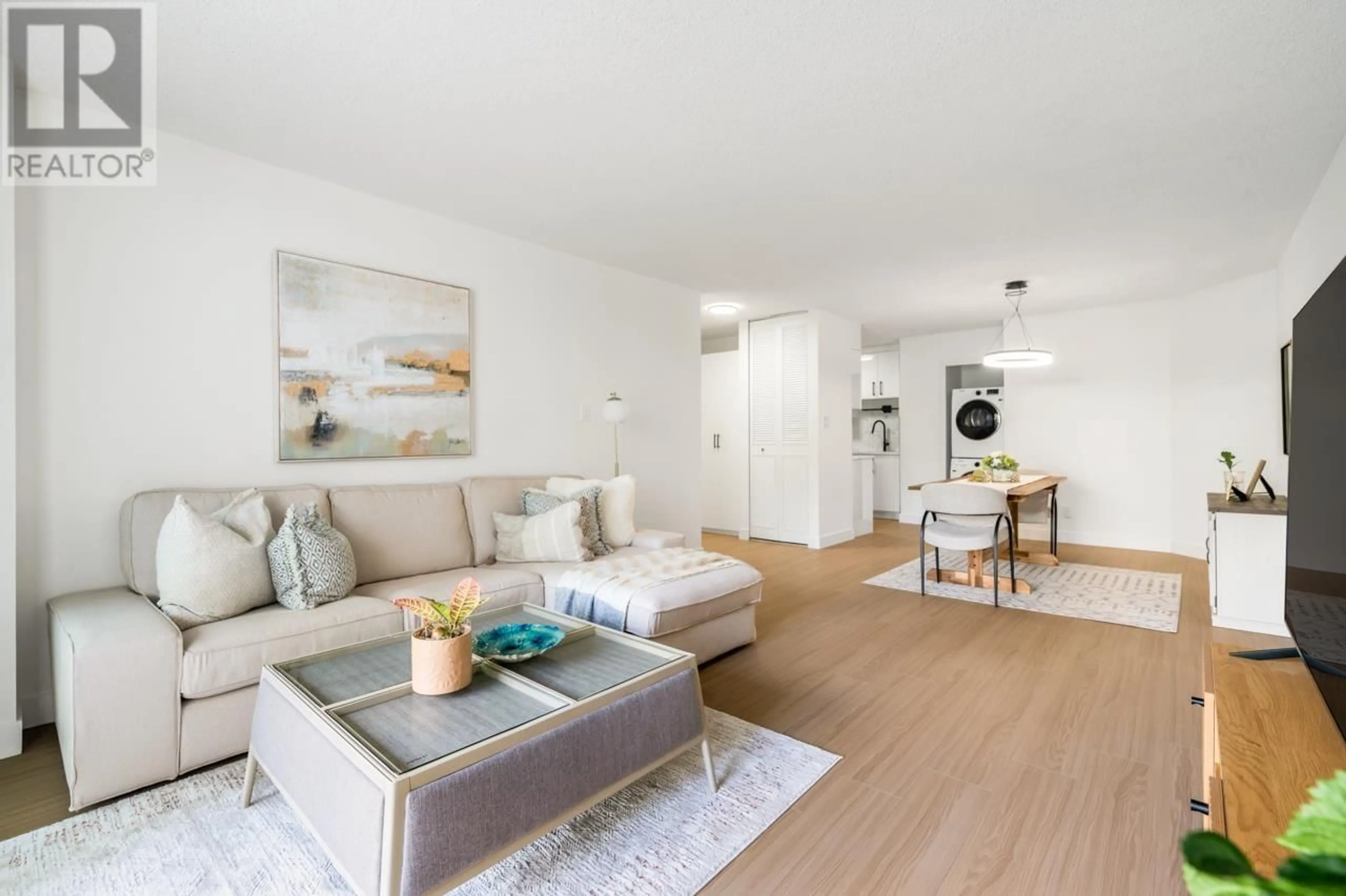 Living room with furniture, wood/laminate floor for 201 - 6455 WILLINGDON AVENUE, Burnaby British Columbia V5H4E4