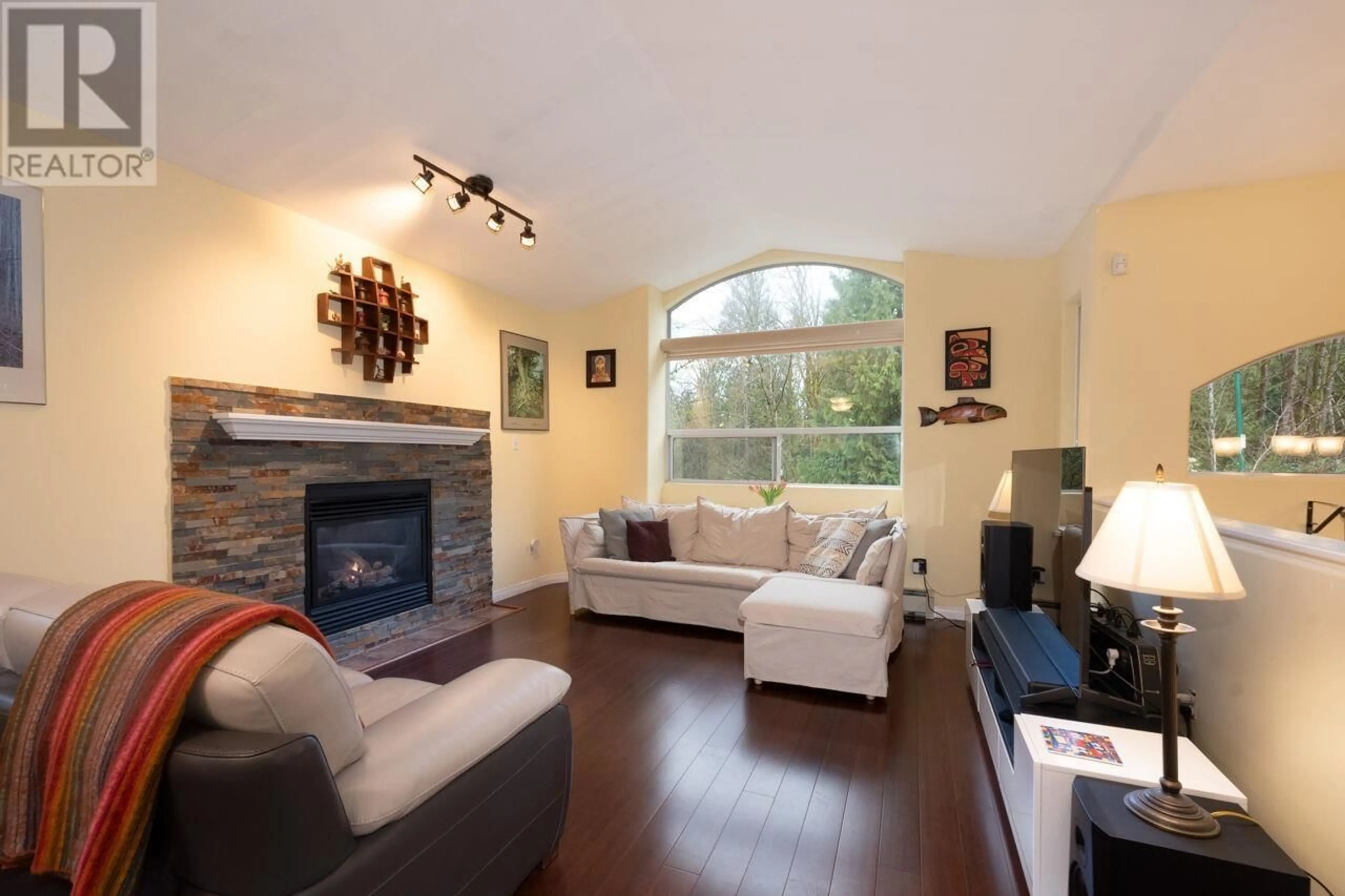 Living room with furniture, wood/laminate floor for 6873 4TH STREET, Burnaby British Columbia V5E4J3